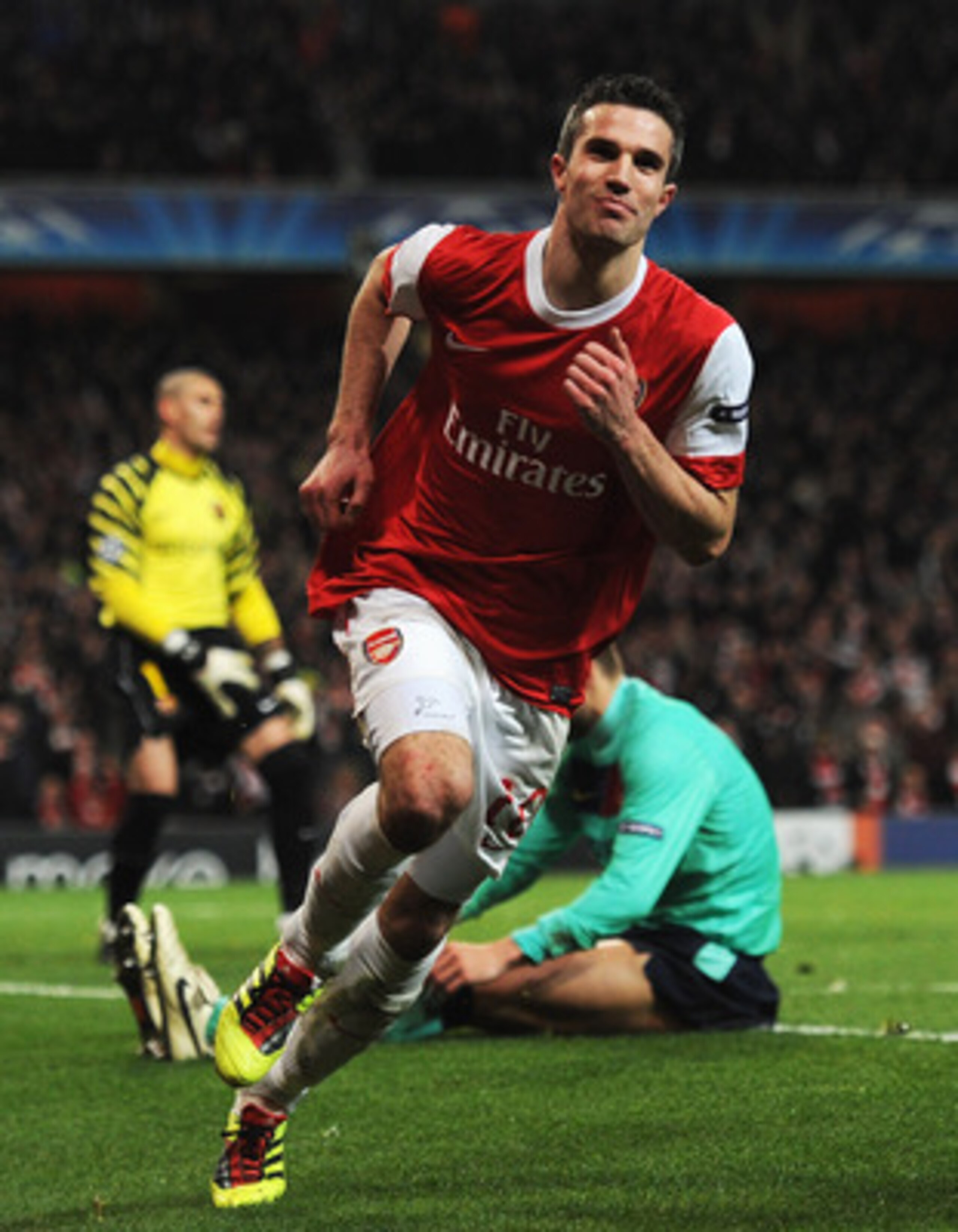 LONDON, ENGLAND - FEBRUARY 16:  Robin van Persie of Arsenal celebrates Arsenal's first goal during the UEFA Champions League round of 16 first leg match between Arsenal and Barcelona at the Emirates Stadium on February 16, 2011 in London, England.  (Photo