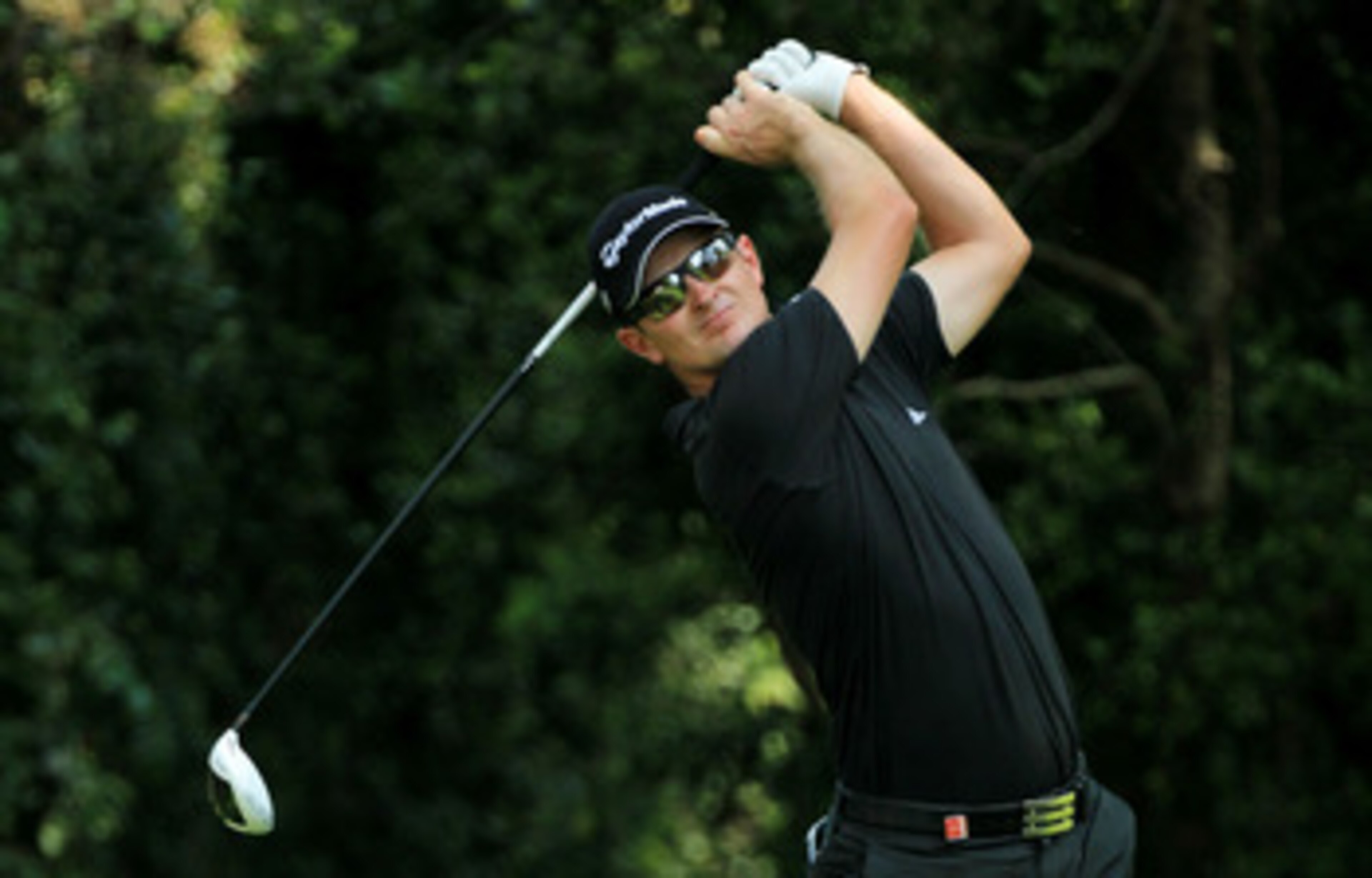 AUGUSTA, GA - APRIL 09:  Justin Rose of England watches his tee shot on the second hole during the third round of the 2011 Masters Tournament at Augusta National Golf Club on April 9, 2011 in Augusta, Georgia.  (Photo by David Cannon/Getty Images)