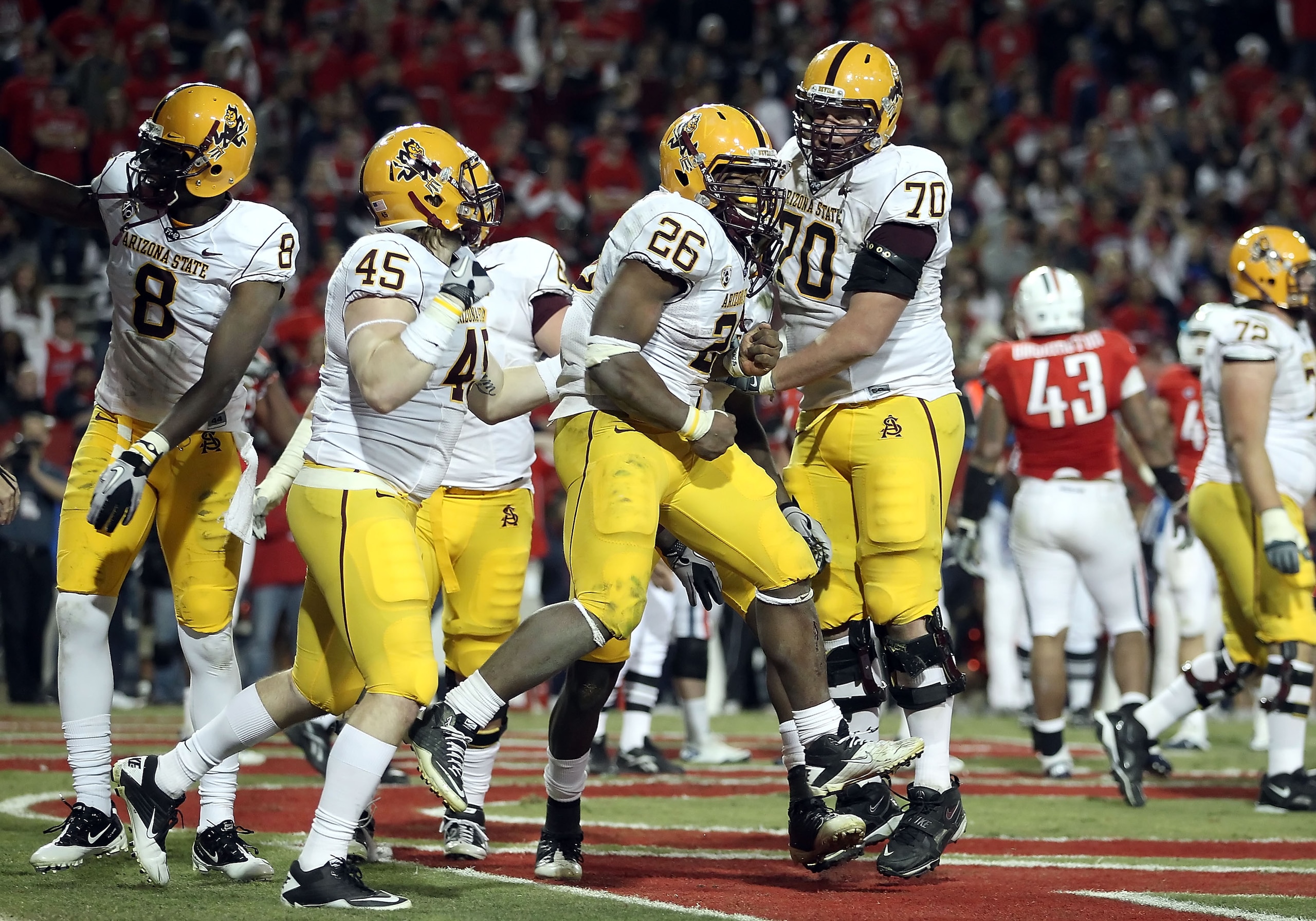 TUCSON, AZ - DECEMBER 02:  Runningback Cameron Marshall #26 of the Arizona State Sun Devils scores a rushing touchdown during the college football game at Arizona Stadium on December 2, 2010 in Tucson, Arizona. The Sun Devils defeated the Wildcats 30-29 i