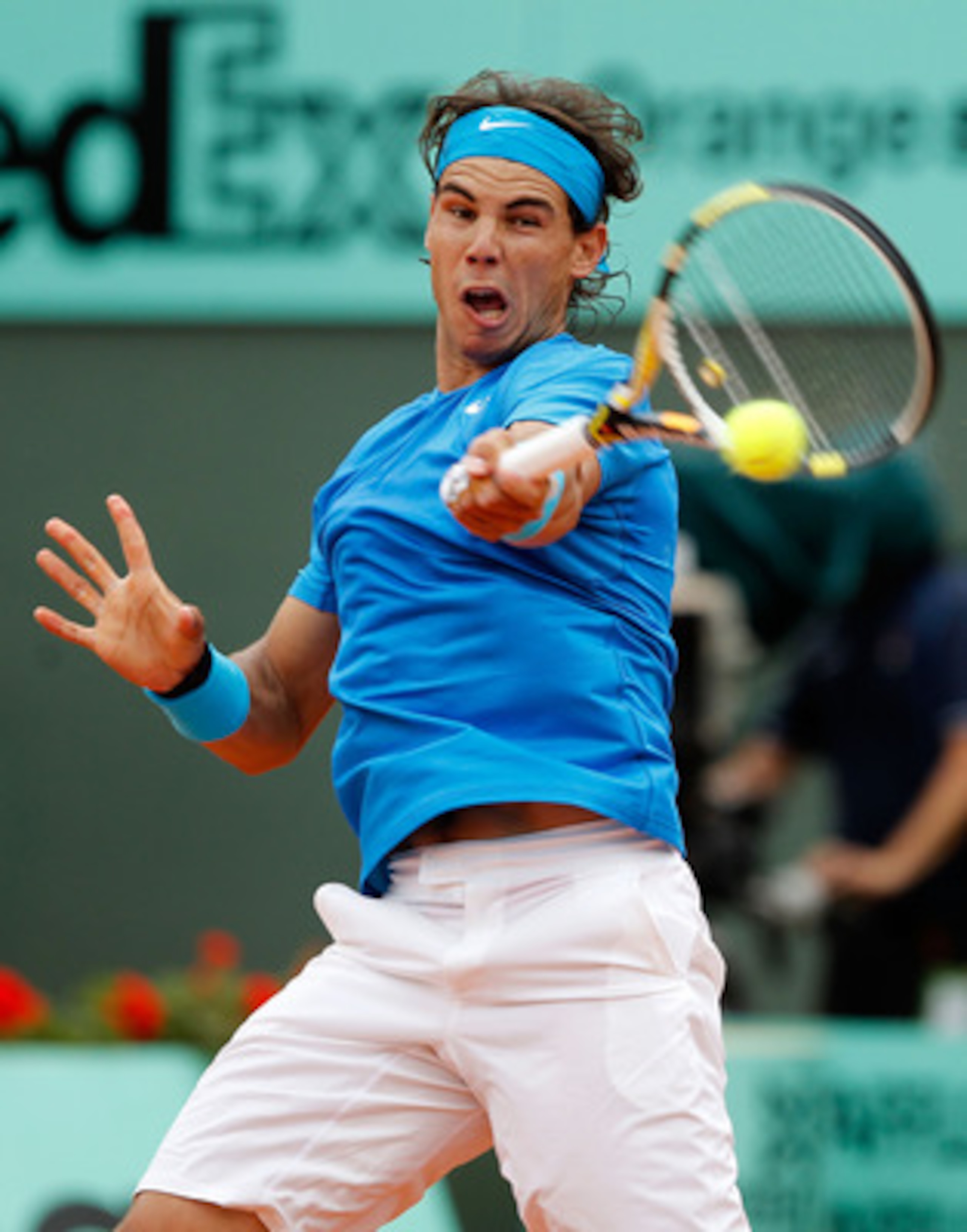 PARIS, FRANCE - MAY 30:  Rafael Nadal of Spain hits a forehand during the men's singles round four match between Rafael Nadal of Spain and Ivan Lubicic of Croatia on day nine of the French Open at Roland Garros on May 30, 2011 in Paris, France.  (Photo by