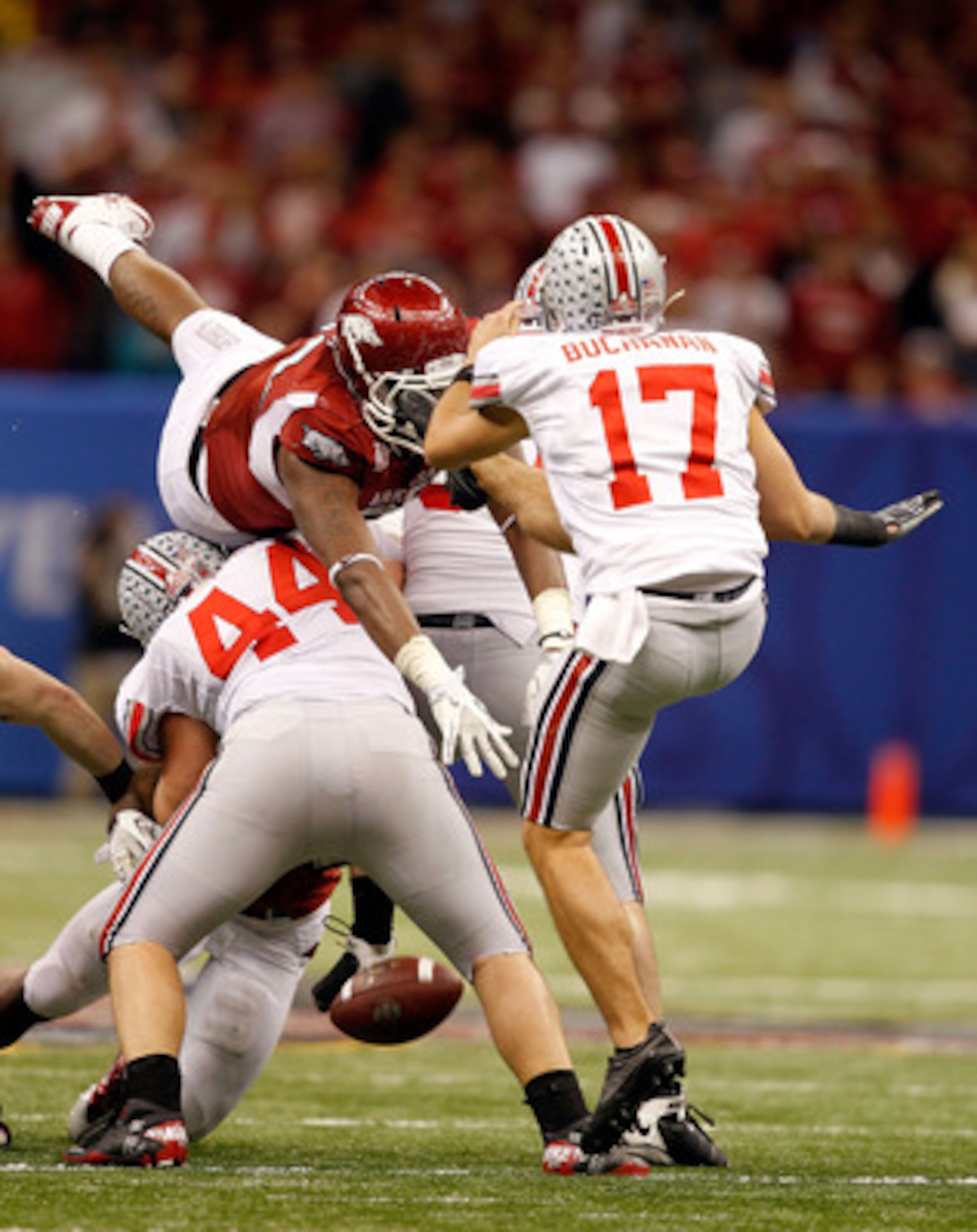 NEW ORLEANS, LA - JANUARY 04:  Chris Gragg #80 of the Arkansas Razorbacks blocks a punt by Ben Buchanan #17 of the Ohio State Buckeyes in the fourth quarter during the Allstate Sugar Bowl at the Louisiana Superdome on January 4, 2011 in New Orleans, Louis