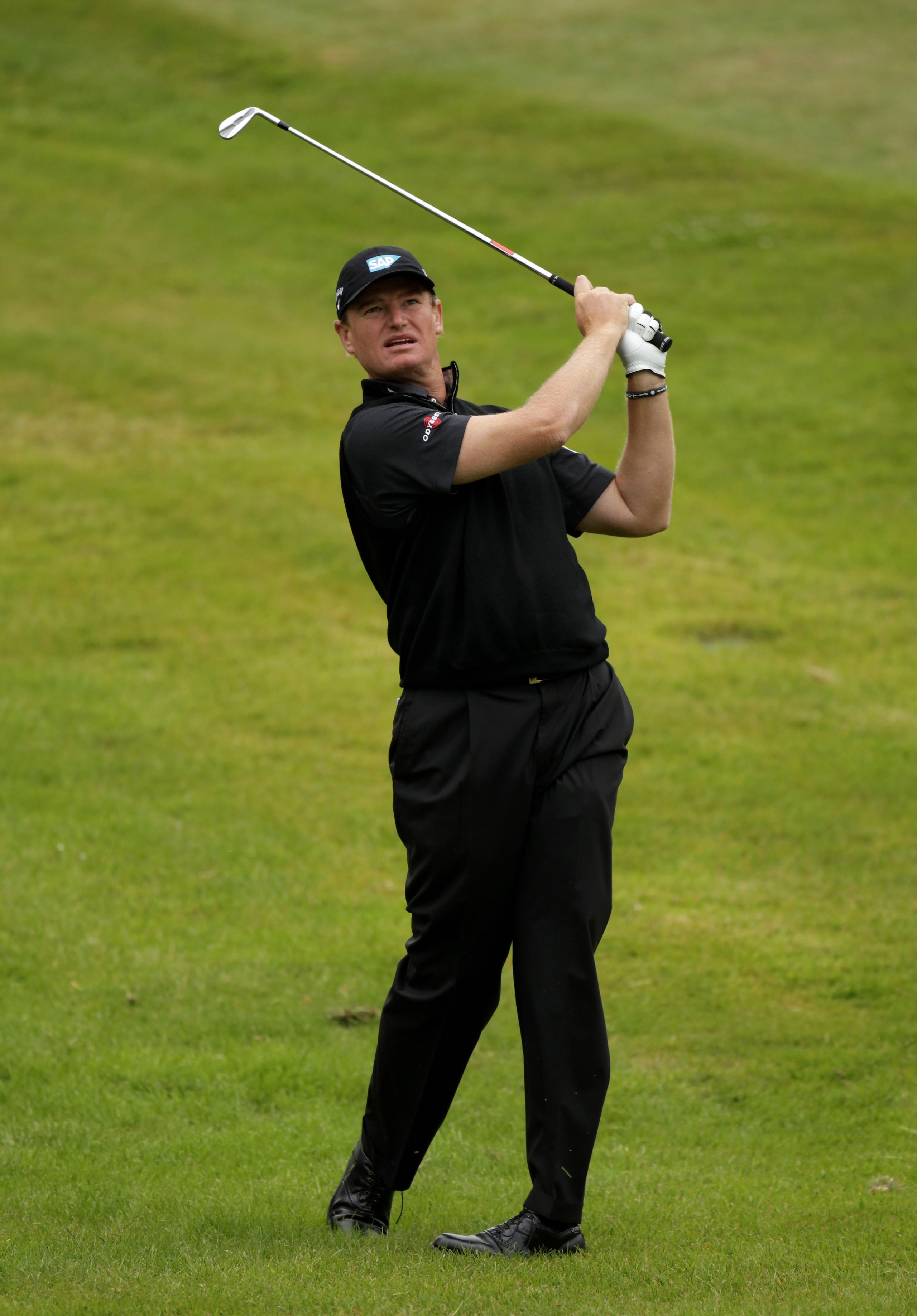 VIRGINIA WATER, ENGLAND - MAY 28:  Ernie Els of South Africa hits an approach shot during the third round of the BMW PGA Championship at the Wentworth Club on May 28, 2011 in Virginia Water, England.  (Photo by Ross Kinnaird/Getty Images)
