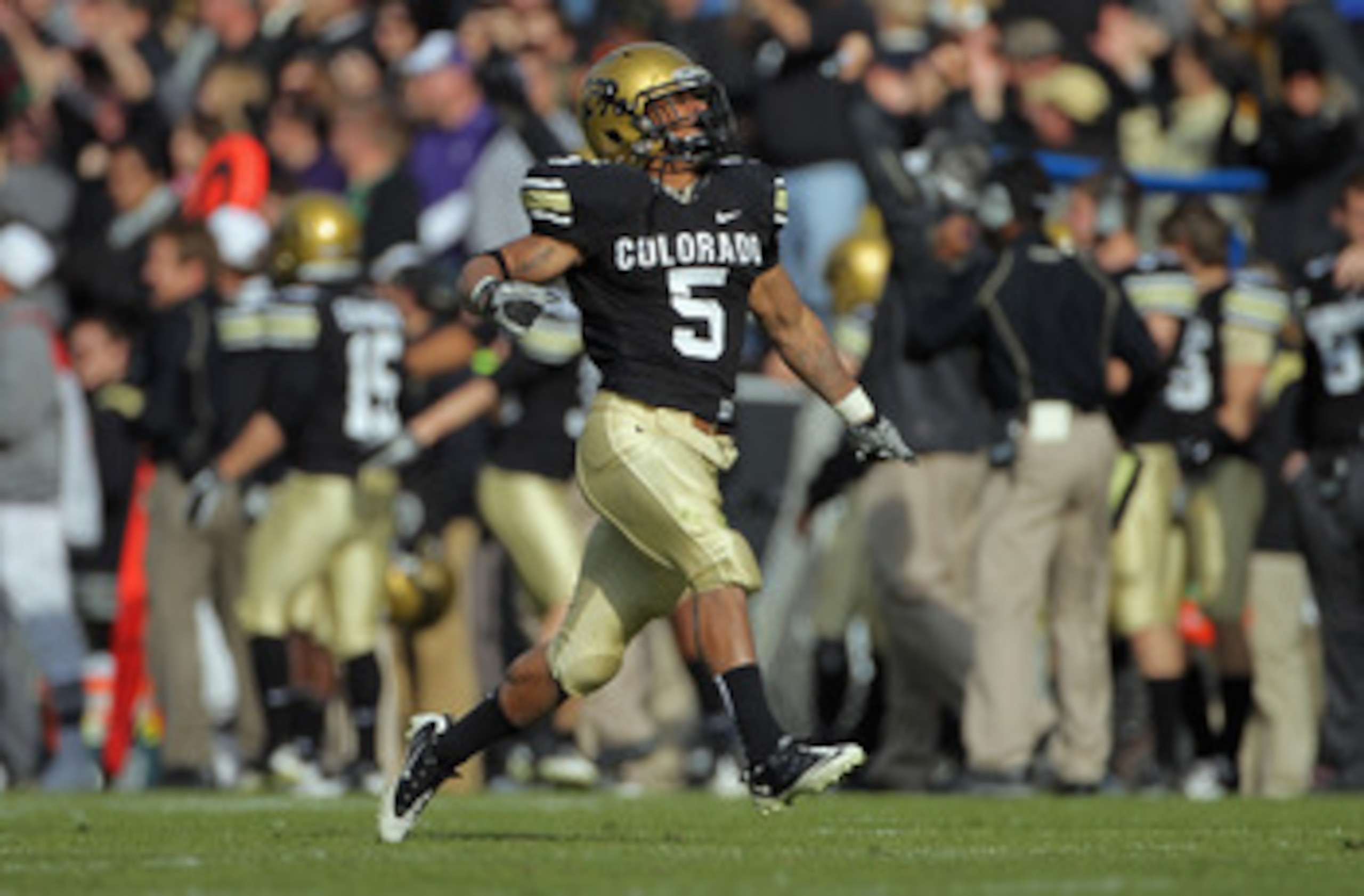 BOULDER, CO - NOVEMBER 20:  Running back Rodney Stewart #5 of the Colorado Buffaloes celebrates after he threw an option pass 23 yards to Toney Clemons for a touchdown against the Kansas State Wildcats at Folsom Field on November 20, 2010 in Boulder, Colo