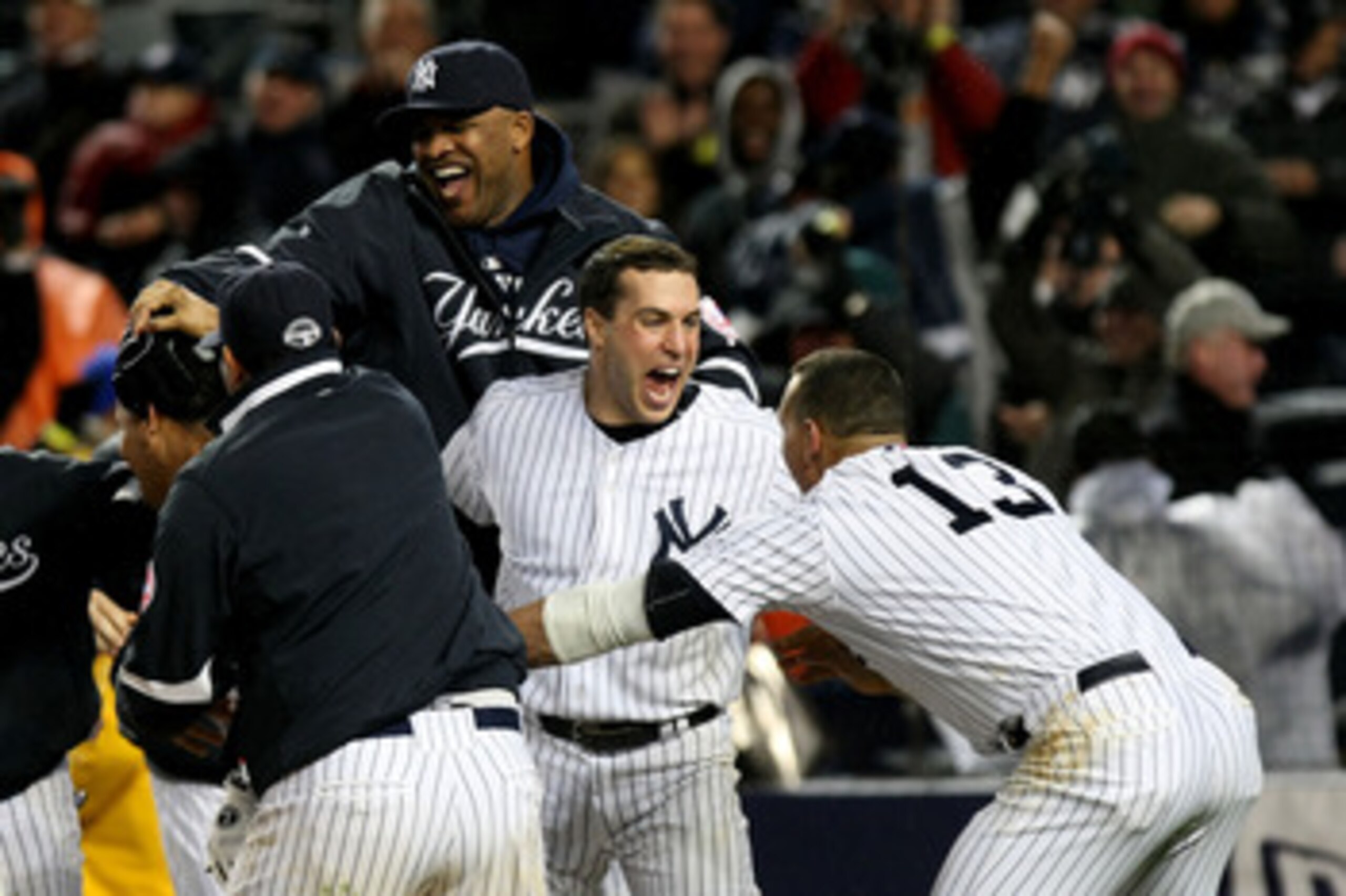 NEW YORK - OCTOBER 17:  CC Sabathia #52, Mark Teixiera #24 and Alex Rodriguez of the New York Yankees celebrate their 4-3 victory over the Los Angeles Angels of Anaheim in Game Two of the ALCS during the 2009 MLB Playoffs at Yankee Stadium on October 17, 