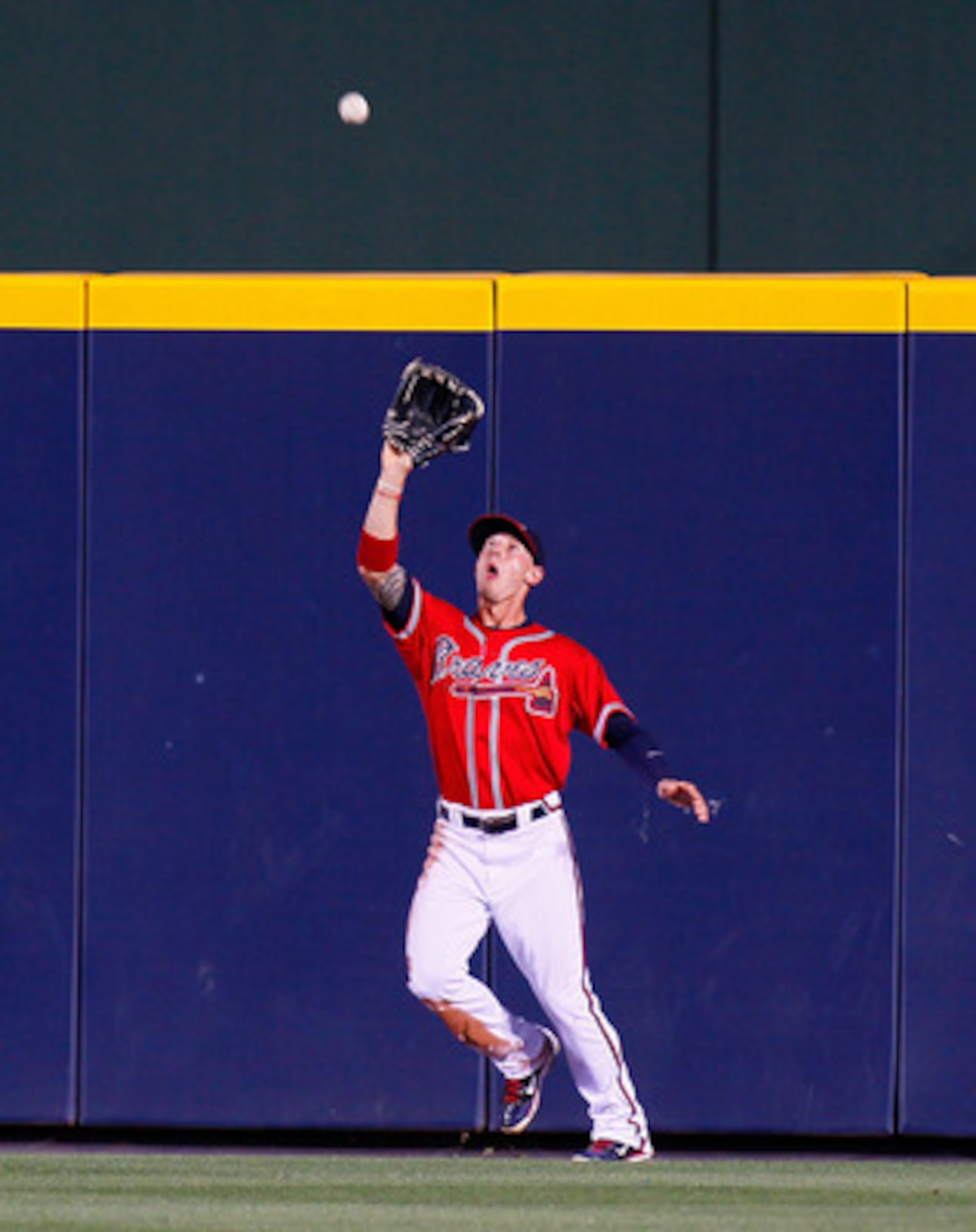 ATLANTA, GA - MAY 29:  Jordan Schafer #1 of the Atlanta Braves catches a deep fly ball hit by Scott Rolen #27 of the Cincinnati Reds in the fourth inning at Turner Field on May 29, 2011 in Atlanta, Georgia.  (Photo by Kevin C. Cox/Getty Images)