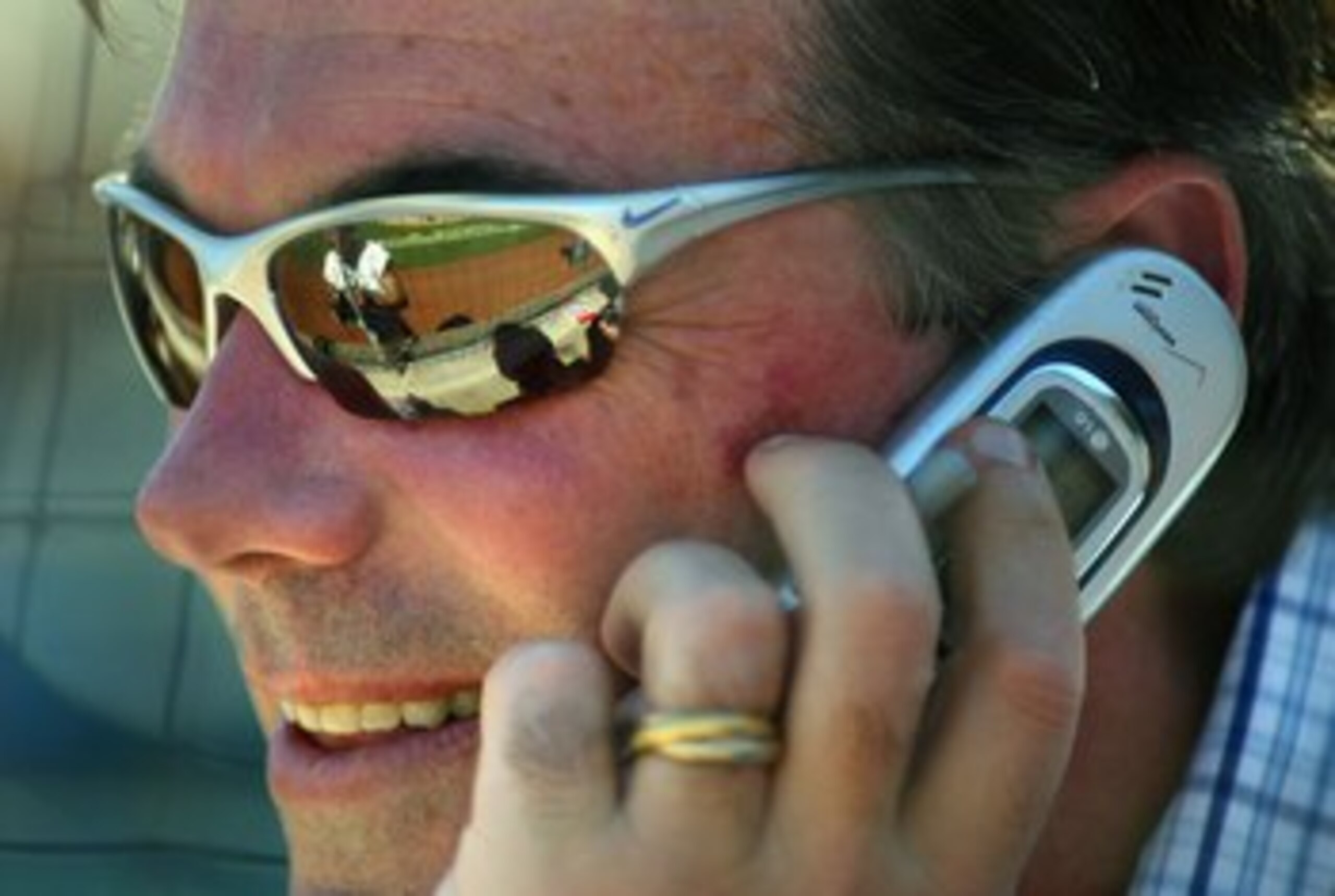 PHOENIX - MARCH 03:  General manager Billy Beane of the Oakland Athletics talks on the phone during the MLB Spring Training game against the Milwaukee Brewers at Phoenix Municipal Stadium on March 3, 2006 in Phoenix, Arizona.  The Brewers defeated the A's
