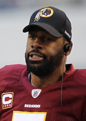 ARLINGTON, TX - DECEMBER 19:  Quarterback Donovan McNabb #5  of the Washington Redskins on the sidelines against play against the Dallas Cowboys at Cowboys Stadium on December 19, 2010 in Arlington, Texas.  (Photo by Ronald Martinez/Getty Images)