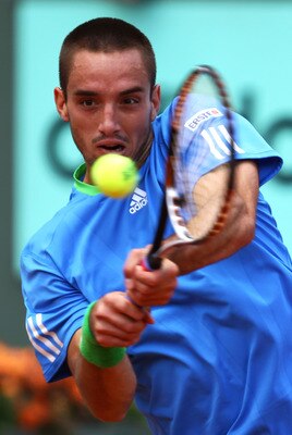 PARIS, FRANCE - MAY 31:  Viktor Troicki of Serbia hits a backhand during the men's singles round four match between Andy Murray of Great Britain and Viktor Troicki of Serbia on day ten of the French Open at Roland Garros on May 31, 2011 in Paris, France.