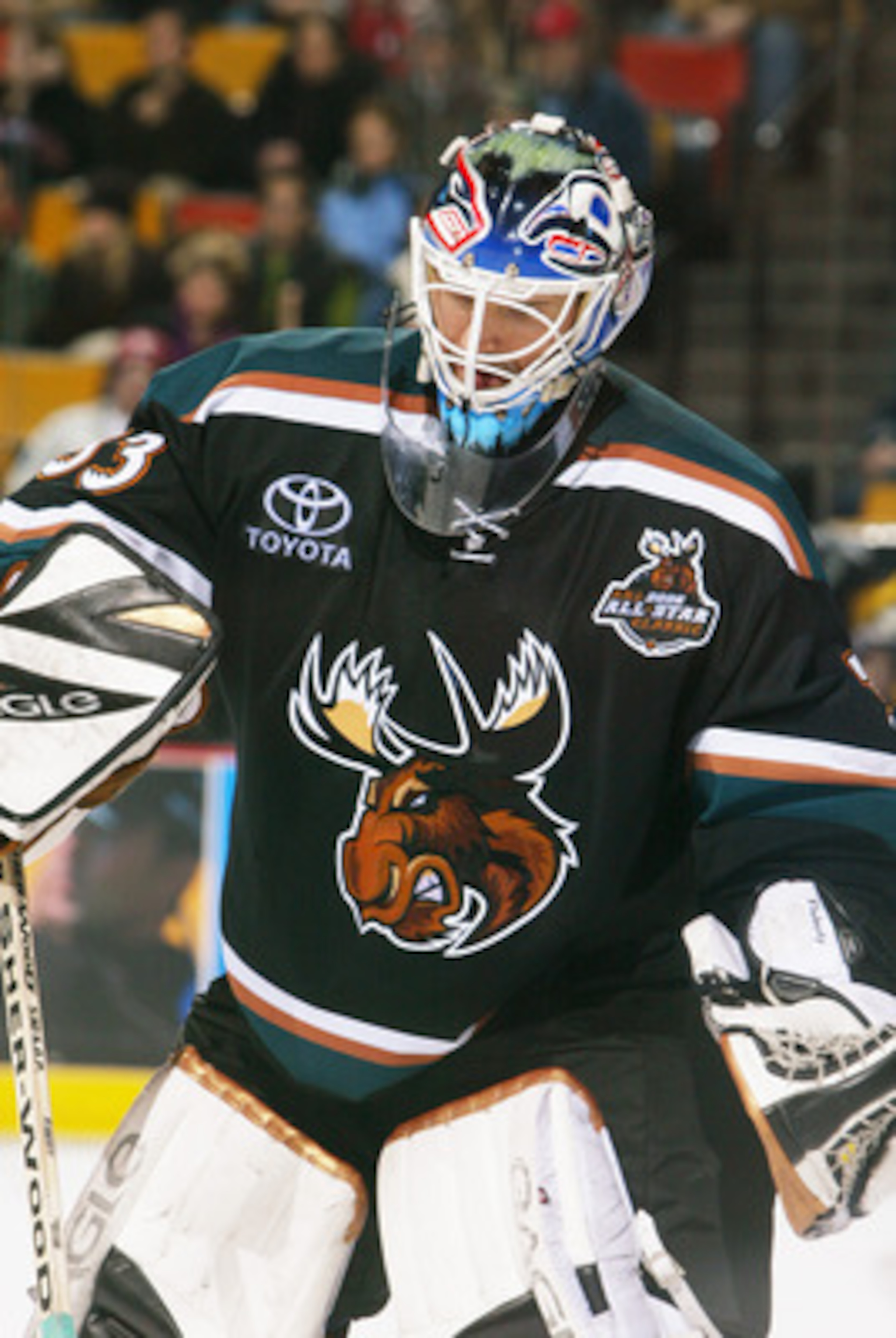 HAMILTON, CANADA - JANUARY 7:  Wade Flaherty #33 of the Manitoba Moose sweeps ice shavings from in front of the net against the Hamilton Bulldogs during the AHL game on January 7, 2006 at Copps Colliseum in Hamilton, Ontario, Canada.  The Bulldogs won 3-2
