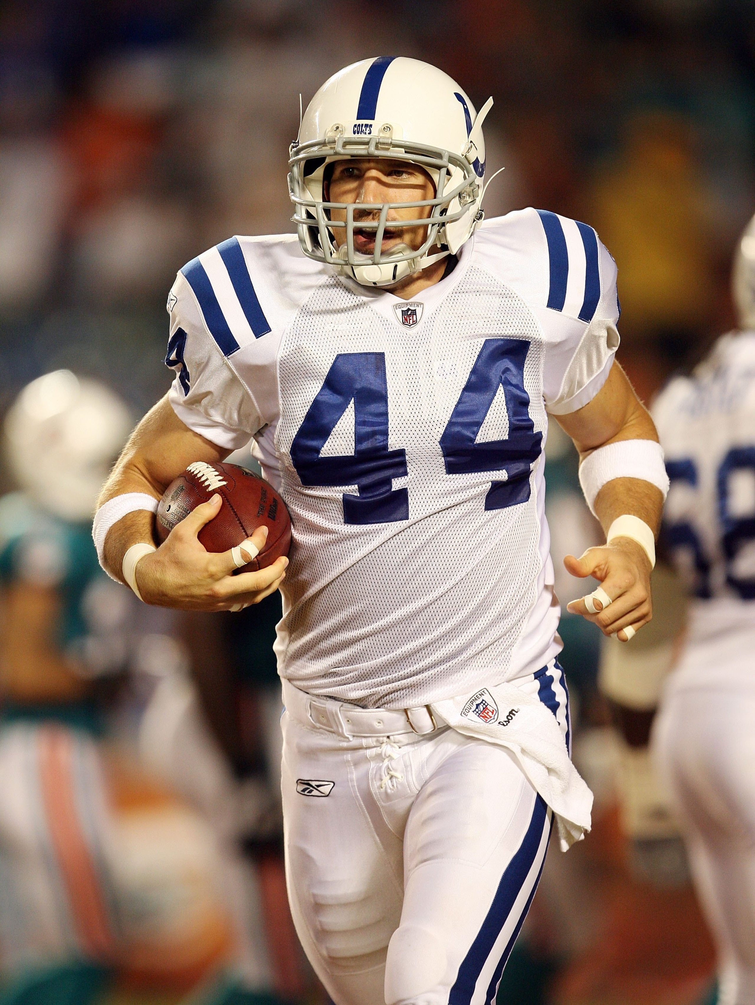 MIAMI - SEPTEMBER 21:  Tight end Dallas Clark #44 of the Indianapolis Colts celebrates on his way back to the bench after scoring a touchdown on the first play from scrimmage against the Miami Dolphins at Land Shark Stadium on September 21, 2009 in Miami,
