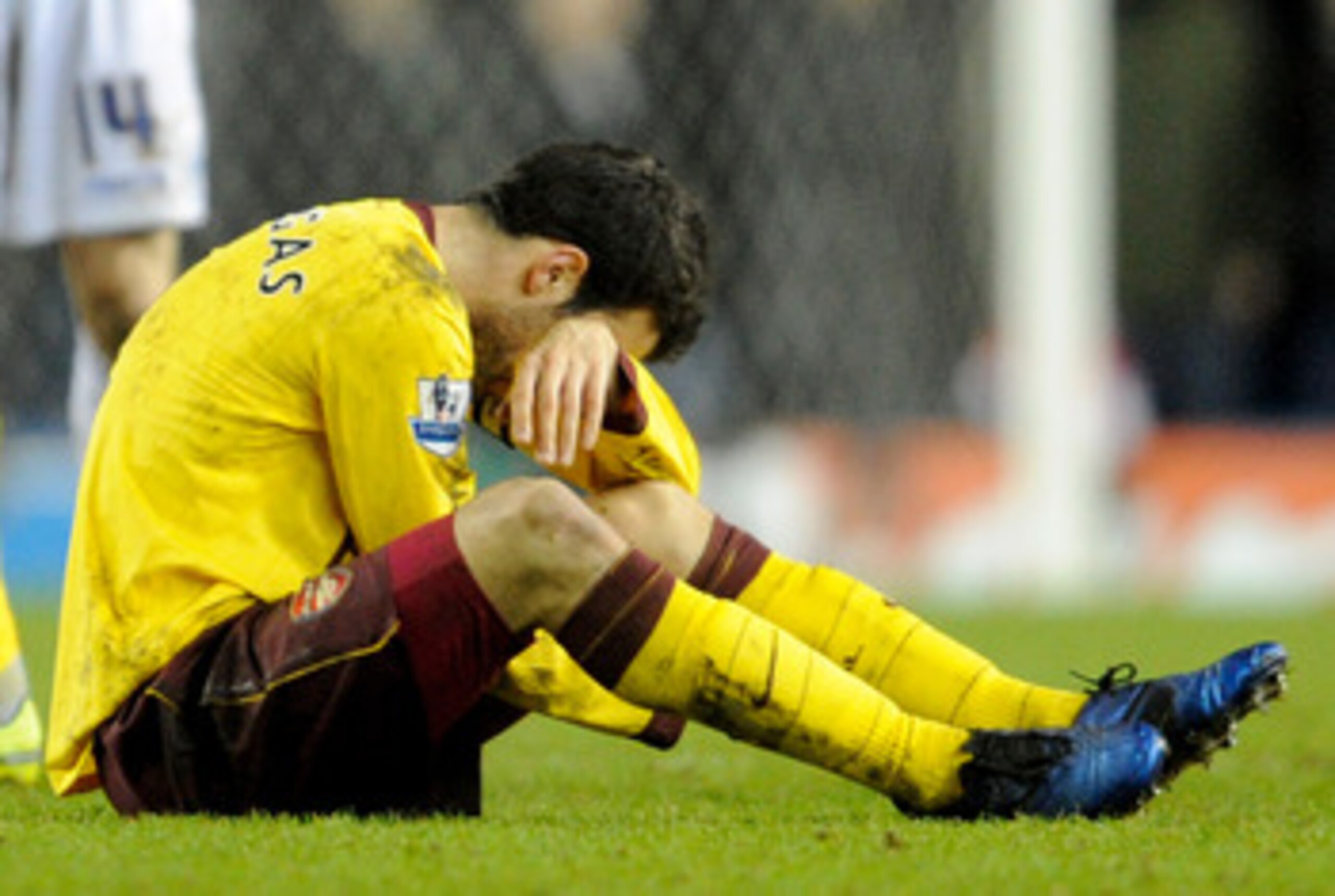 LEEDS, UNITED KINGDOM - JANUARY 19:   Cesc Fabregas of Arsenal goes down injured during the FA Cup sponsored by E.On Third Round Replay match between Leeds United and Arsenal at Elland Road on January 19, 2011 in Leeds, England. (Photo by Michael Regan/Ge