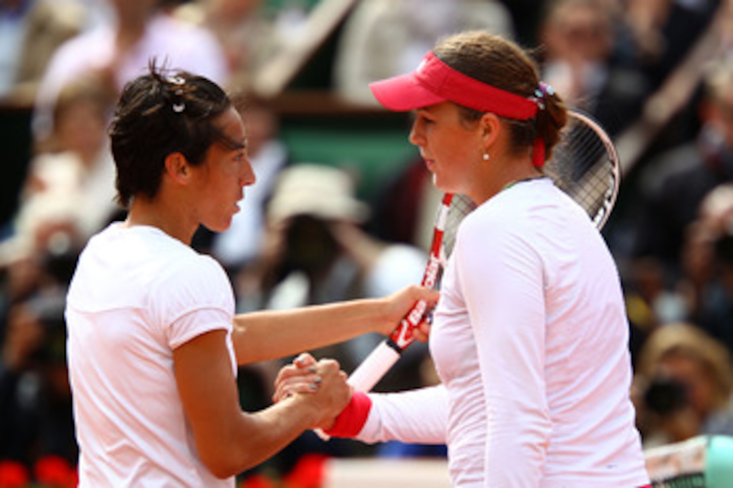 PARIS, FRANCE - MAY 31:  Francesca Schiavone of Italy shakes hands with Anastasia Pavlyuchenkova of Russia following her victory during the women's singles quarterfinal match between Anastasia Pavlyuchenkova of Russia and Francesca Schiavone of Italy on d