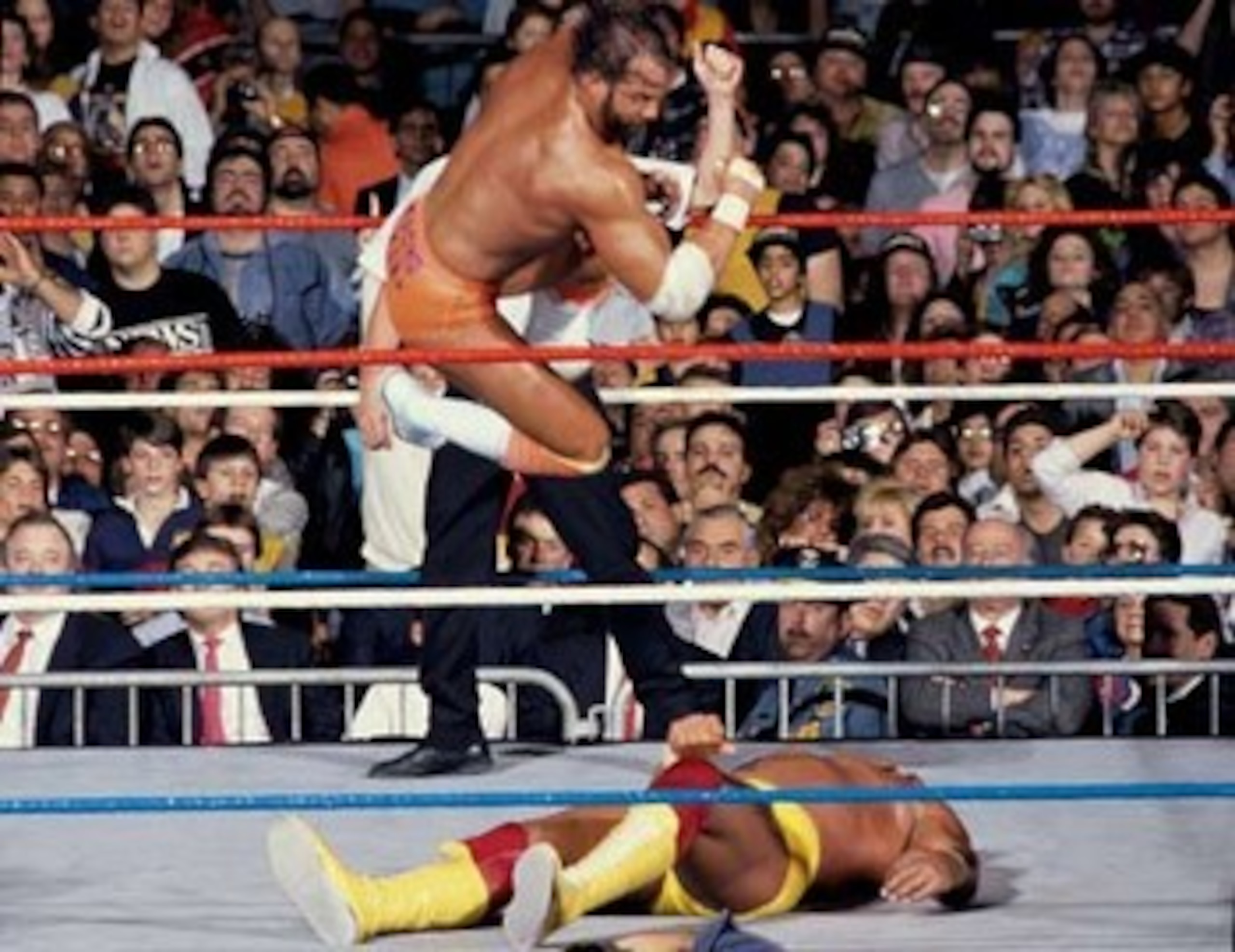Randy Savage landing his trademark elbow on Hulk Hogan