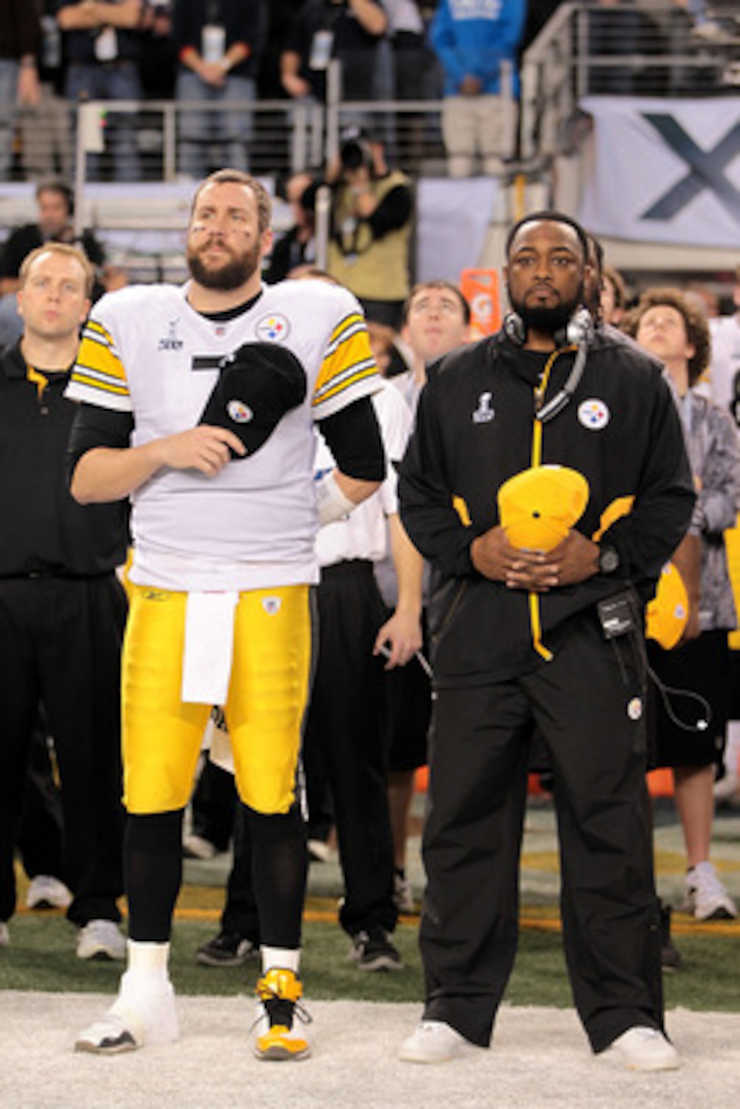 ARLINGTON, TX - FEBRUARY 06:  Ben Roethlisberger #7 and head coach Mike Tomlin of the Pittsburgh Steelers look on during the National Anthem during Super Bowl XLV at Cowboys Stadium on February 6, 2011 in Arlington, Texas.  (Photo by Jamie Squire/Getty Im
