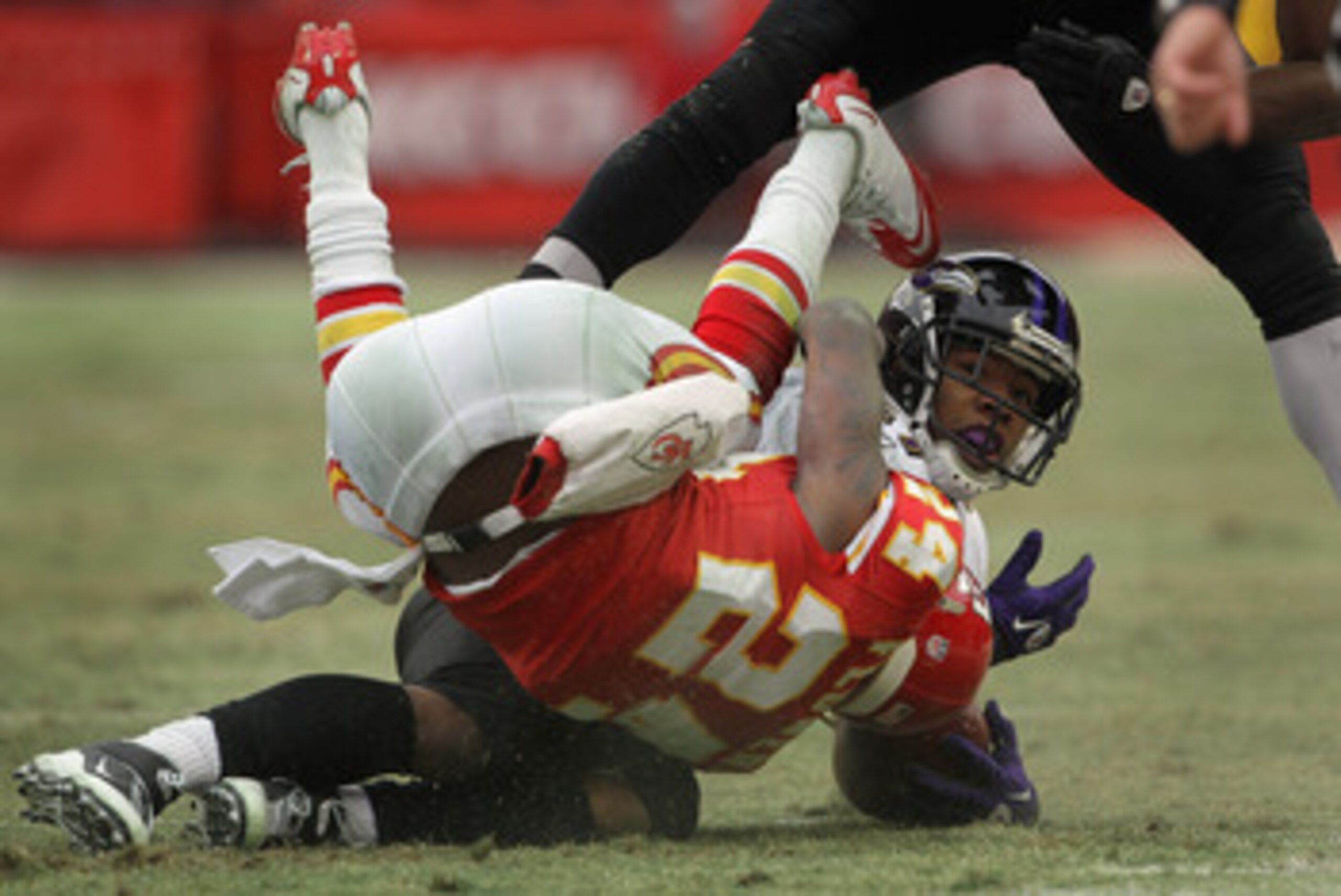 KANSAS CITY, MO - JANUARY 09: Cornerback Brandon Flowers #24 of the Kansas City Chiefs rolls over running back Ray Rice #27 of the Baltimore Ravens after making the tackle during the 2011 AFC wild card playoff game at Arrowhead Stadium on January 9, 2011 KANSAS CITY, MO - JANUARY 09: Cornerback Brandon Flowers #24 of the Kansas City Chiefs rolls over running back Ray Rice #27 of the Baltimore Ravens after making the tackle during the 2011 AFC wild card playoff game at Arrowhead Stadium on January 9, 2011