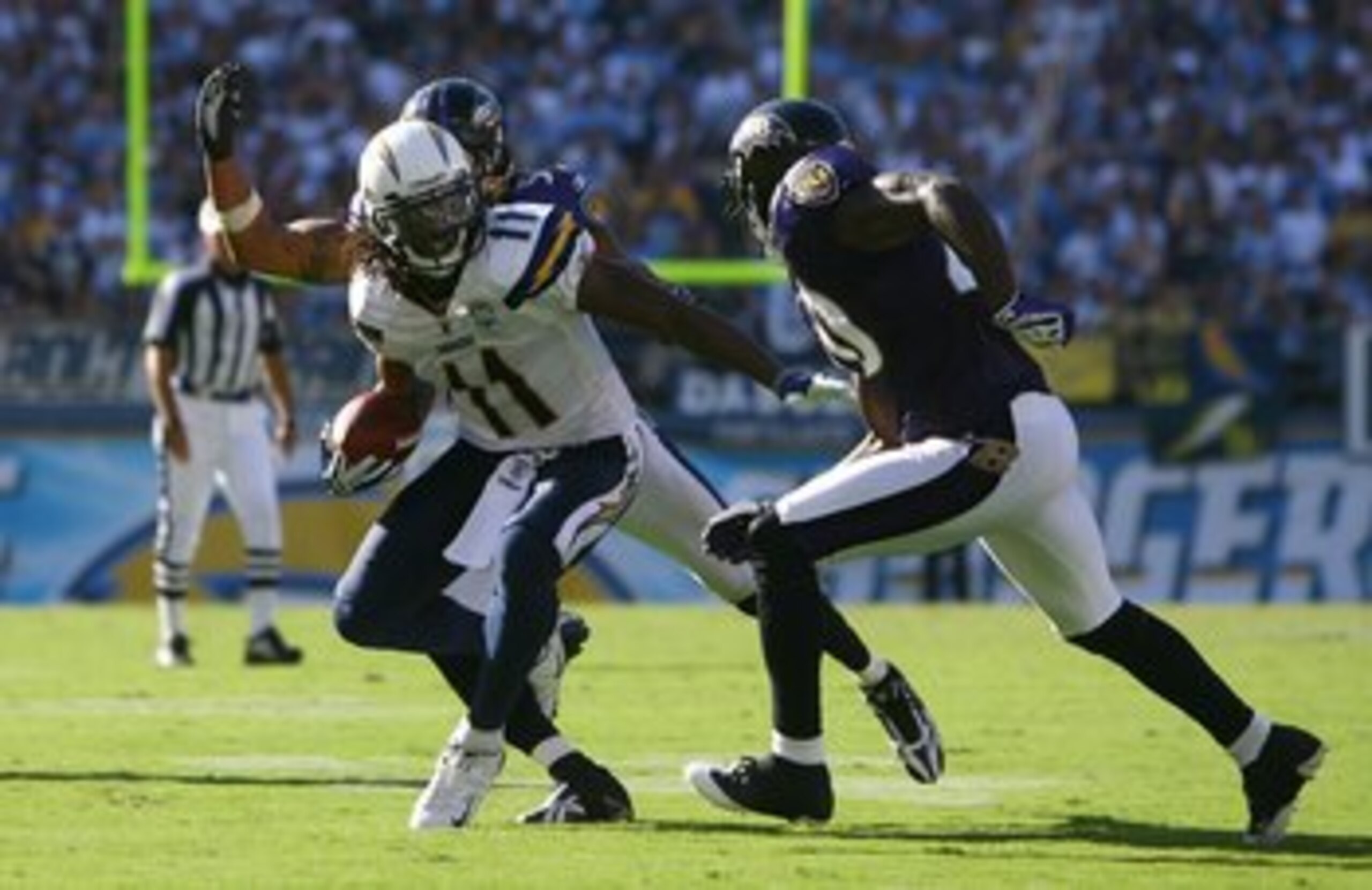 SAN DIEGO - SEPTEMBER 20: Legedu Naanee #11 of the San Diego Chargers carries the ball against the Baltimore Ravens at Qualcomm Stadium on September 20, 2009 in San Diego, California. The Ravens defeated the Chargers 31-26. (Photo by Jeff Gross/Getty Im SAN DIEGO - SEPTEMBER 20: Legedu Naanee #11 of the San Diego Chargers carries the ball against the Baltimore Ravens at Qualcomm Stadium on September 20, 2009 in San Diego, California. The Ravens defeated the Chargers 31-26. (Photo by Jeff Gross/Getty Im