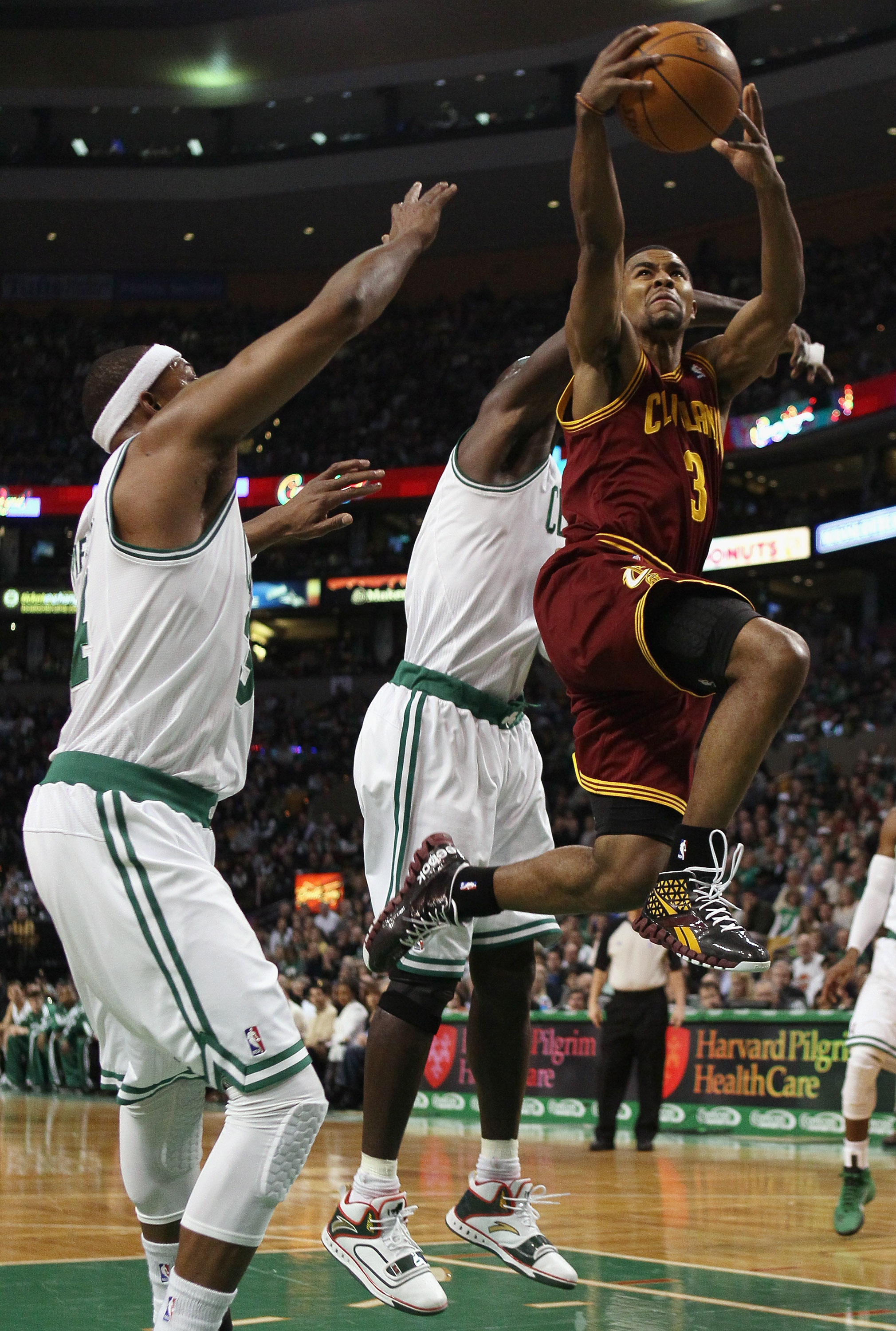 BOSTON, MA - JANUARY 25:  Ramon Sessions #3 of the of the Cleveland Cavaliers takes a shot as Paul Pierce #34 and Kevin Garnett #5 of the Boston Celtics defend on January 25, 2011 at the TD Garden in Boston, Massachusetts.   NOTE TO USER: User expressly a