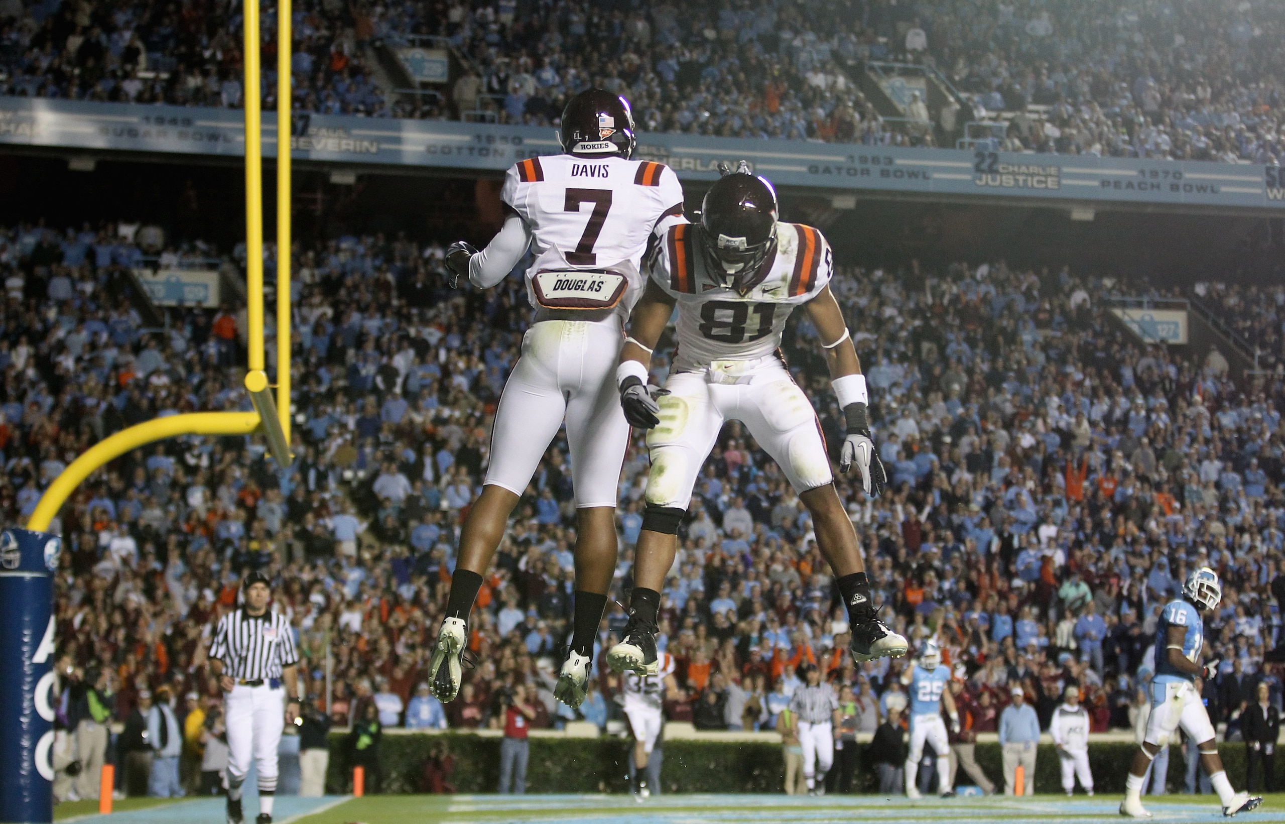 CHAPEL HILL, NC - NOVEMBER 13:  Marcus Davis #7 of the Virginia Tech Hokies celebrates after scoring a touchdown with teammate Jarrett Boykin #81 against the North Carolina Tar Heels during their game at Kenan Stadium on November 13, 2010 in Chapel Hill,
