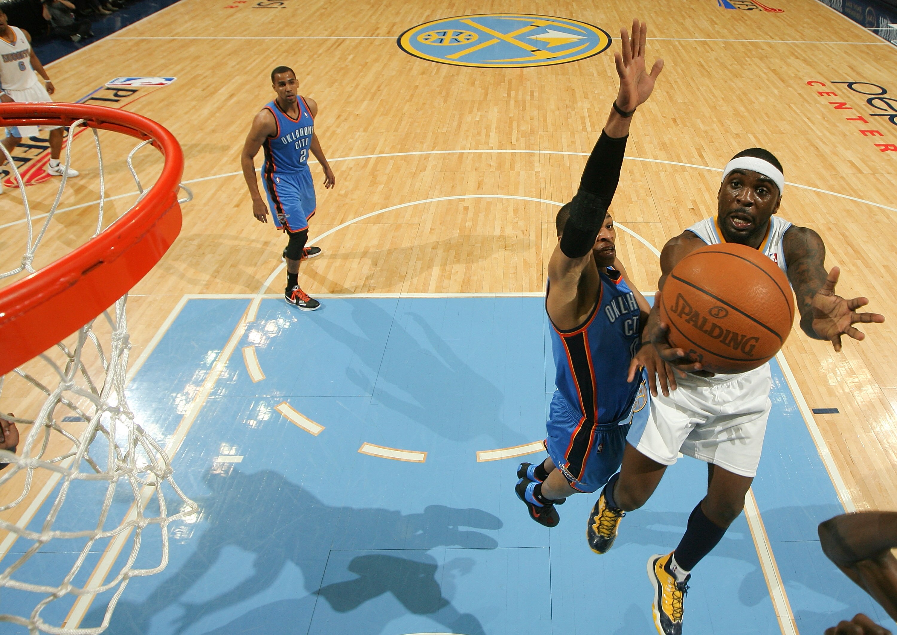 DENVER, CO - APRIL 25:  Ty Lawson #3 of the Denver Nuggets goes up for a layup against Russell Westbrook #0 of the Oklahoma City Thunder in Game Four of the Western Conference Quarterfinals in the 2011 NBA Playoffs at Pepsi Center on April 25, 2011 in Den