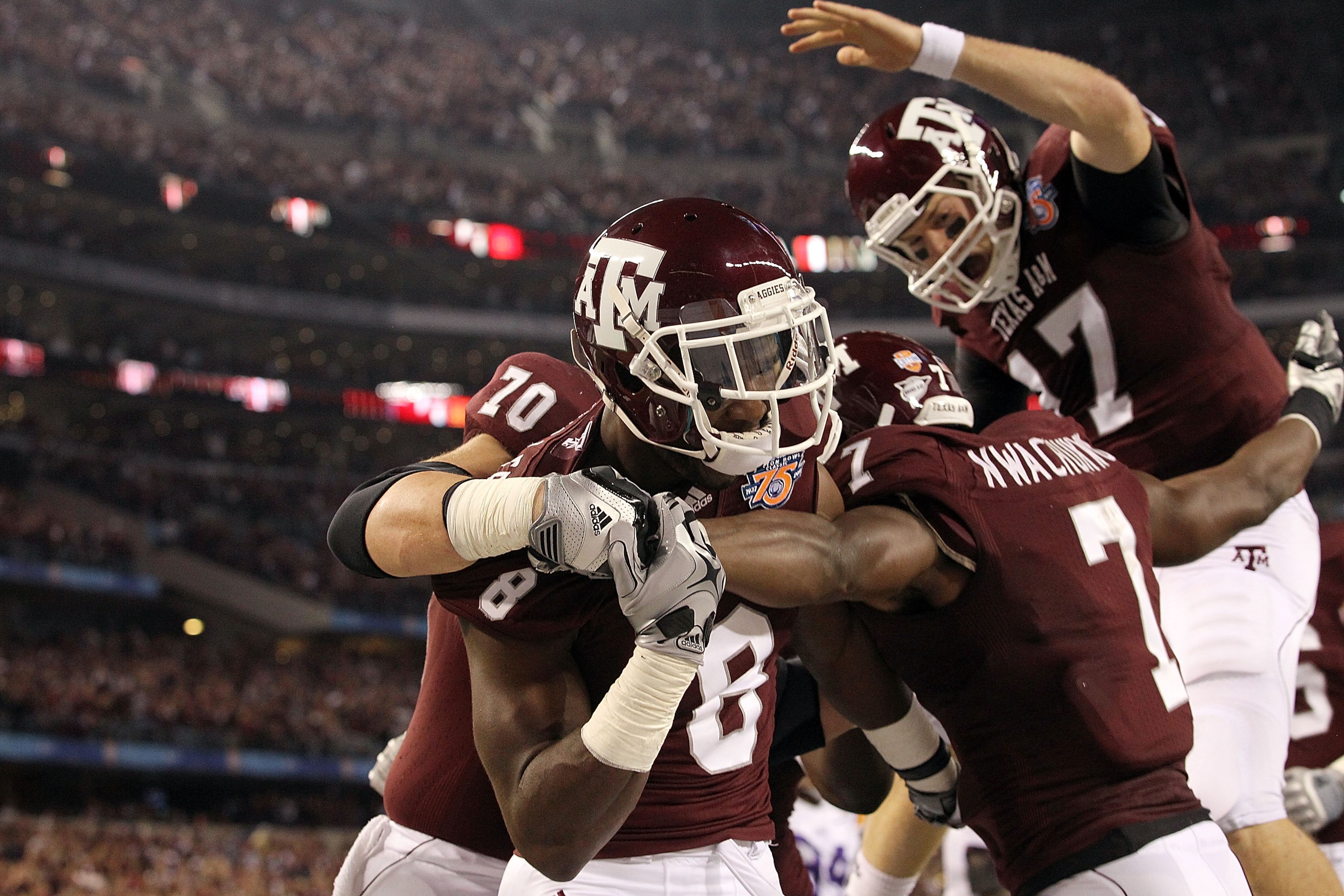 ARLINGTON, TX - JANUARY 07:  Wide receiver Jeff Fuller #8 and Uzoma Nwachukwu #7 of the Texas A&M Aggies celebrate a touchdown against the LSU Tigers during the AT&T Cotton Bowl at Cowboys Stadium on January 7, 2011 in Arlington, Texas.  (Photo by Ronald 
