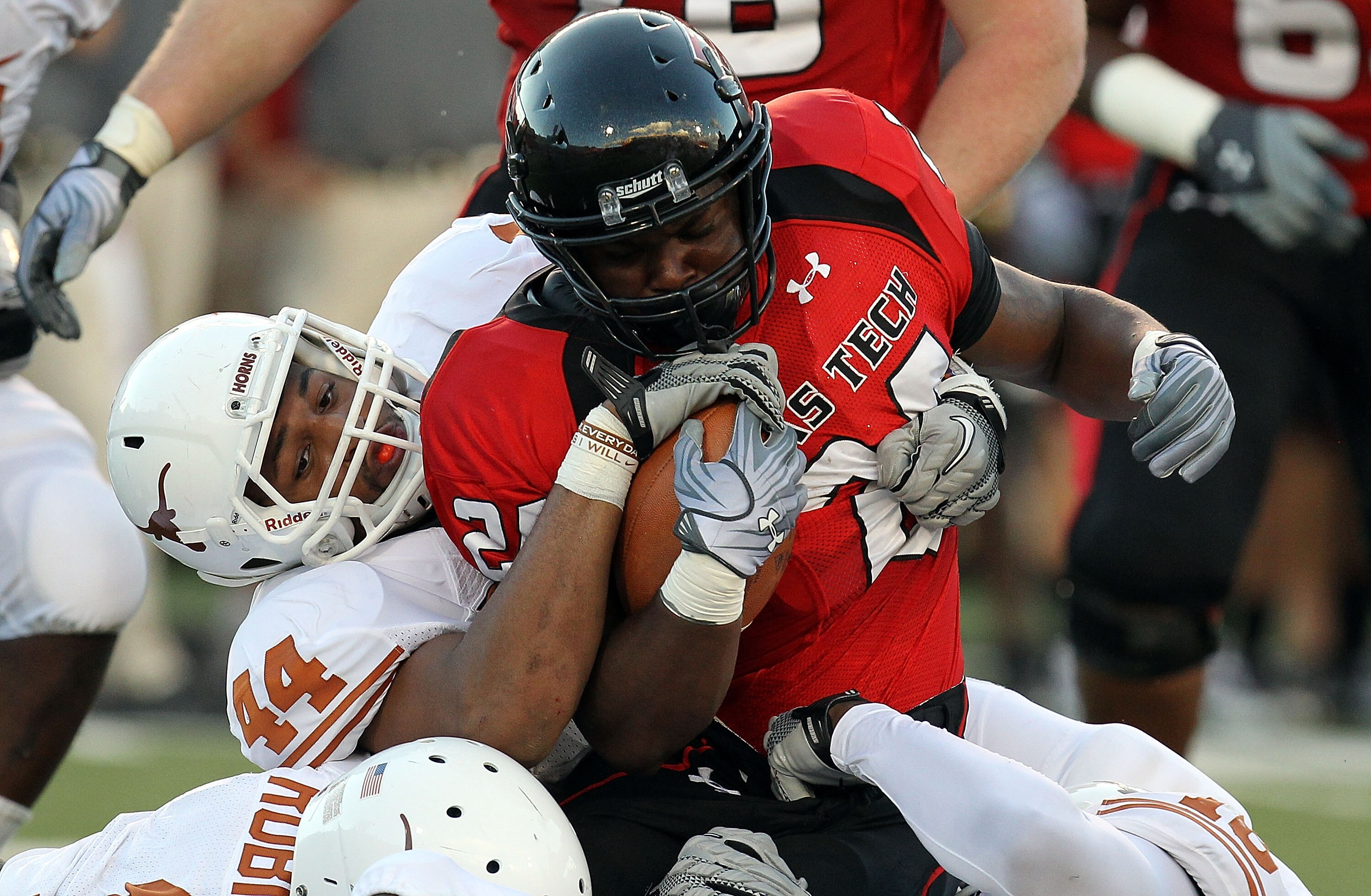 LUBBOCK, TX - SEPTEMBER 18:  Running back Eric Stephens #24 of the Texas Tech Red Raiders is tackled by Jackson Jeffcoat #44 of the Texas Longhorns at Jones AT&T Stadium on September 18, 2010 in Lubbock, Texas.  (Photo by Ronald Martinez/Getty Images)