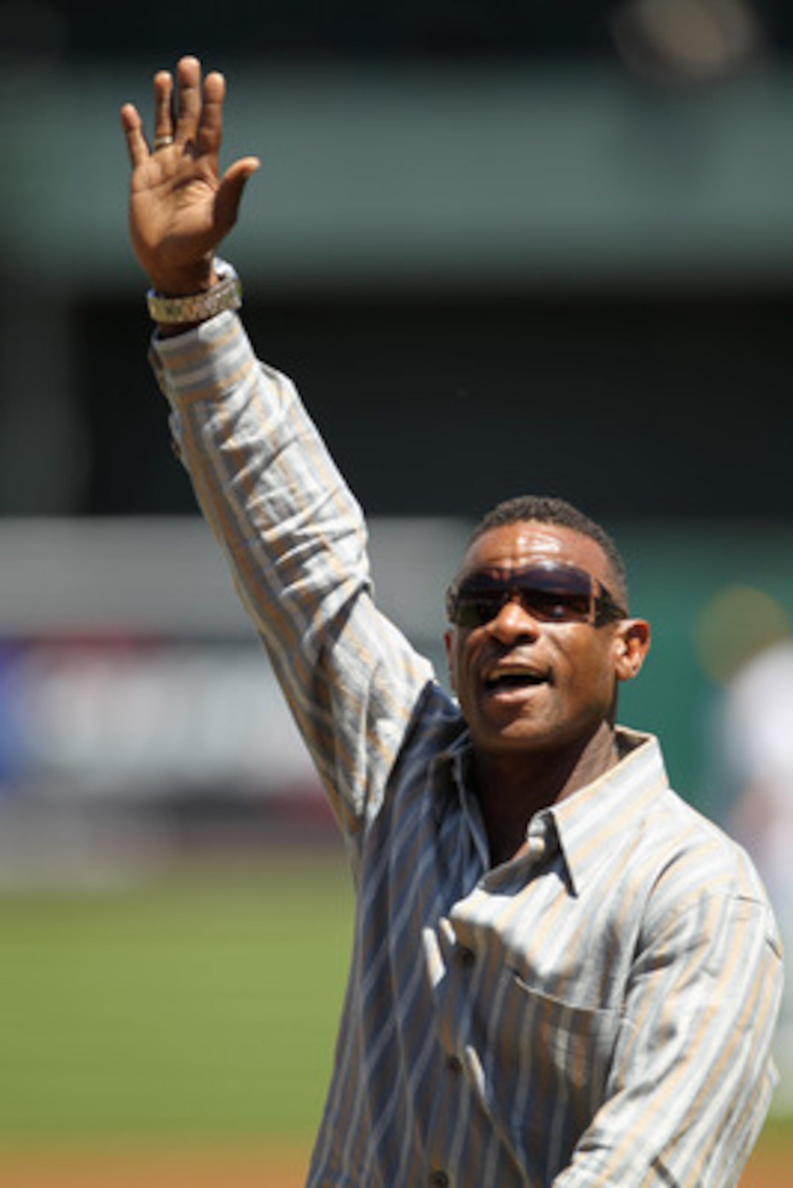 OAKLAND, CA - APRIL 30:  Rickey Henderson waves to the crowd after he threw out the ceremonial first pitch before the Oakland Athletics' game against the Texas Rangers at Oakland-Alameda County Coliseum on April 30, 2011 in Oakland, California.  (Photo by