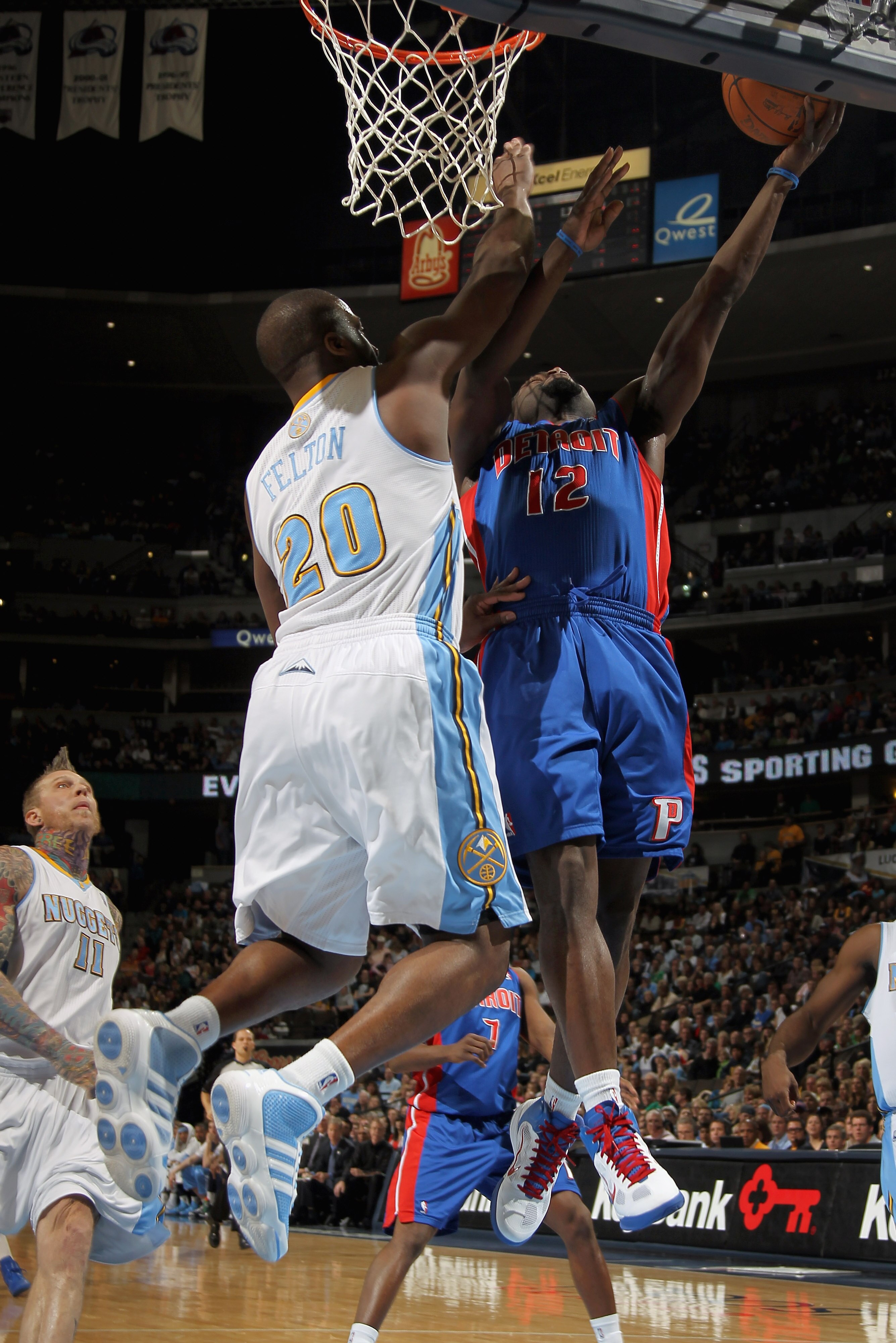 DENVER, CO - MARCH 12:  Will Bynum #12 of the Detroit Pistons puts up a shot against the defense of Raymond Felton #20 of the Denver Nuggets at the Pepsi Center on March 12, 2011 in Denver, Colorado. The Nuggets defeated the Pistons 131-101.  NOTE TO USER