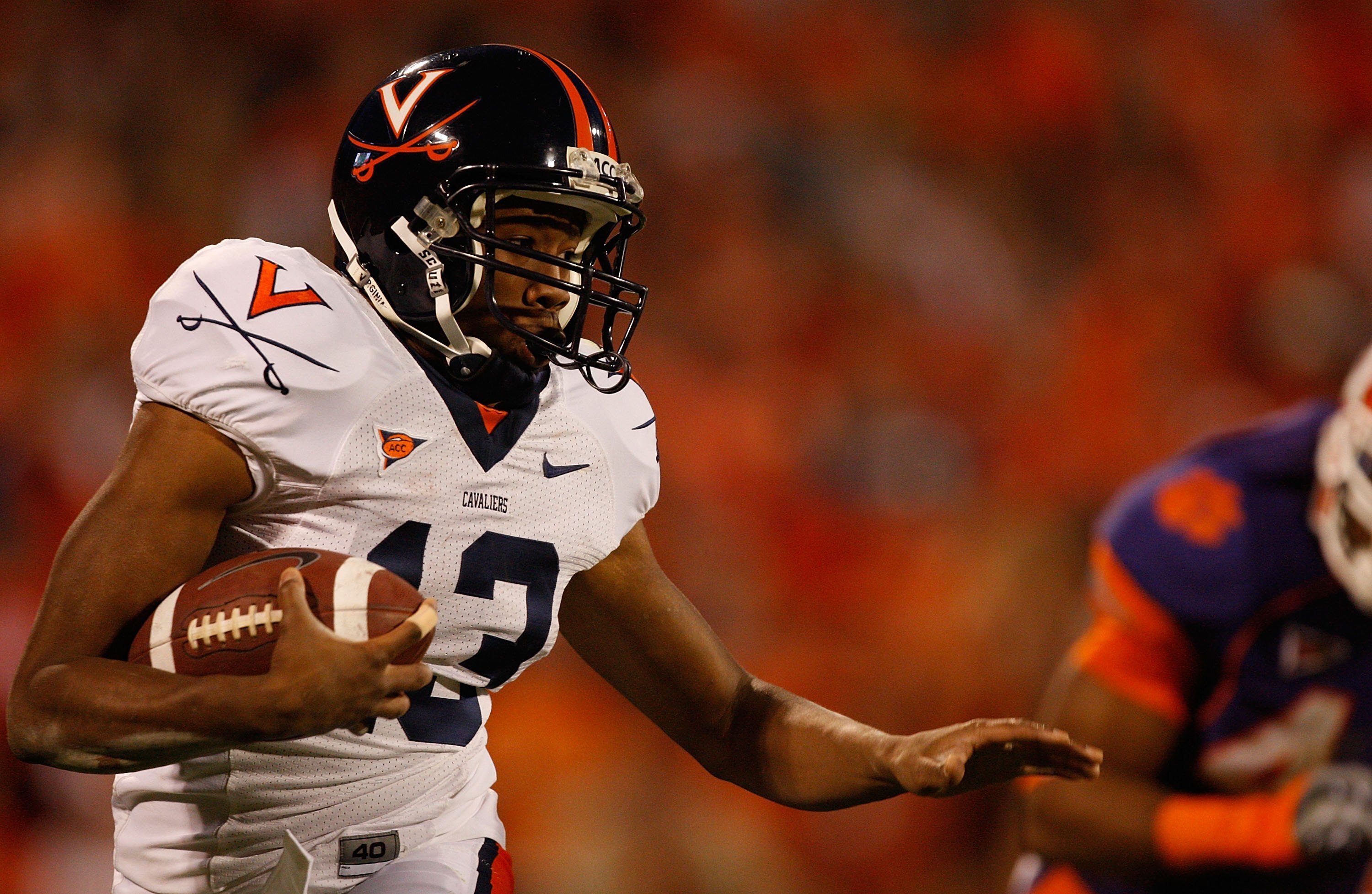 CLEMSON, SC - NOVEMBER 21:  Chase Minnifield #13 of the Virginia Cavaliers runs with the ball during the game against the Clemson Tigers at Memorial Stadium on November 21, 2009 in Clemson, South Carolina.  (Photo by Streeter Lecka/Getty Images)