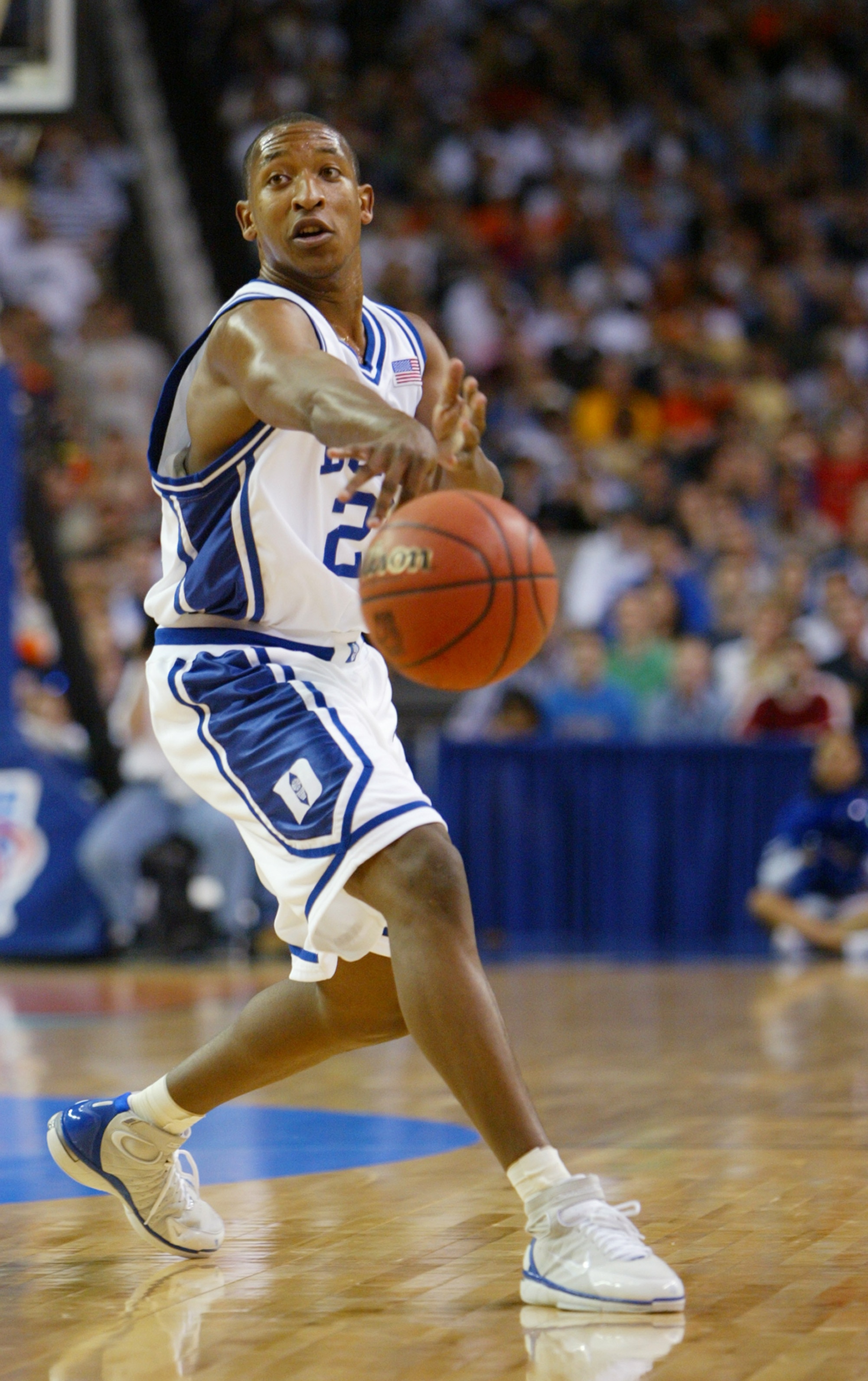 ATLANTA - MARCH 26:  Chris Duhon #21 of the Duke Blue Devils passes the ball during the Sweet 16 game of the NCAA Division I Men's Basketball Tournament against the the Illinois Fighting Illini at the Georgia Dome on March 26, 2004 in Atlanta, Georgia. Du