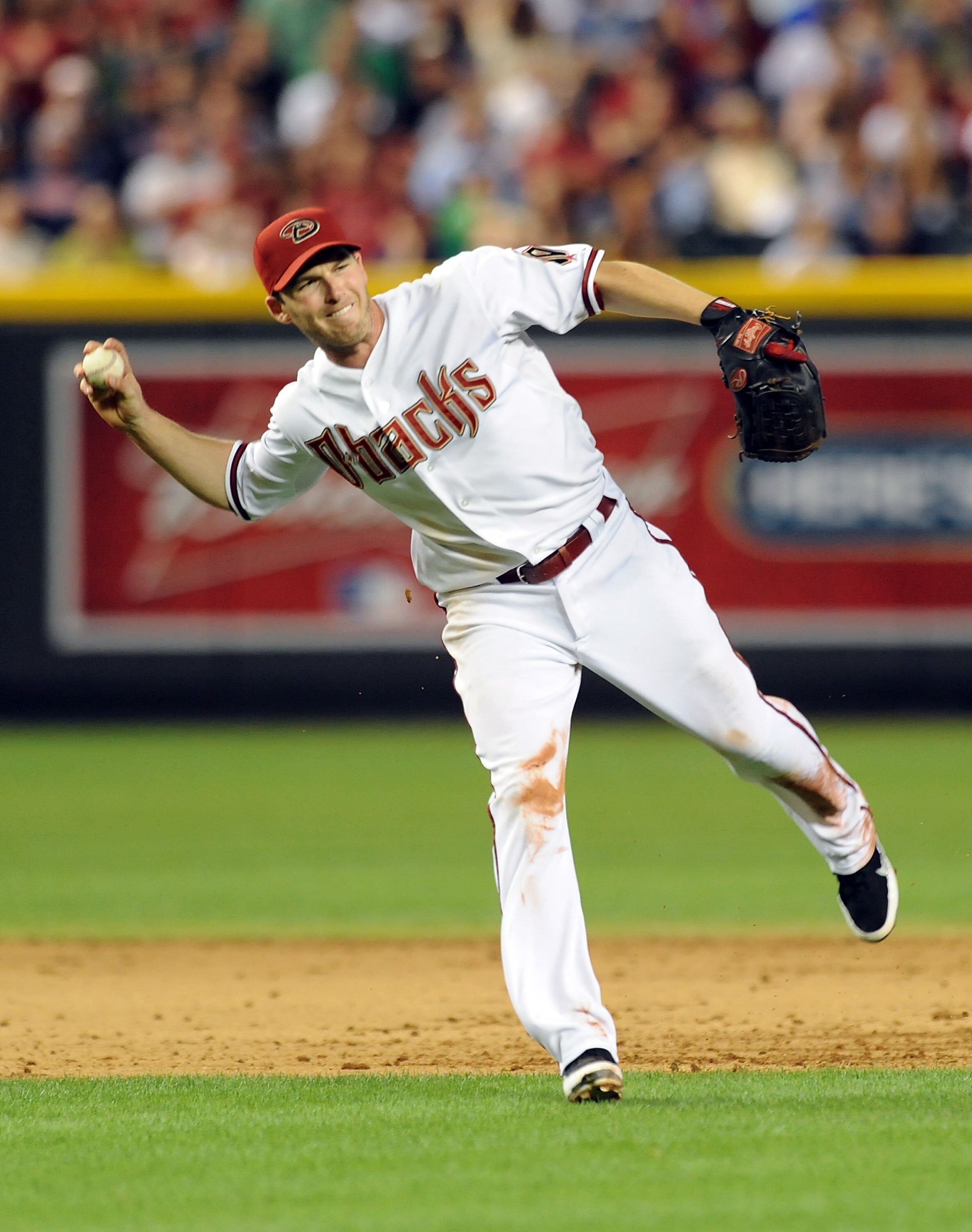 PHOENIX - MAY 20:  Stephen Drew #6 of the Arizona Diamondbacks makes a barehanded play against the Minnesota Twins at Chase Field on May 20, 2011 in Phoenix, Arizona.  (Photo by Norm Hall/Getty Images)