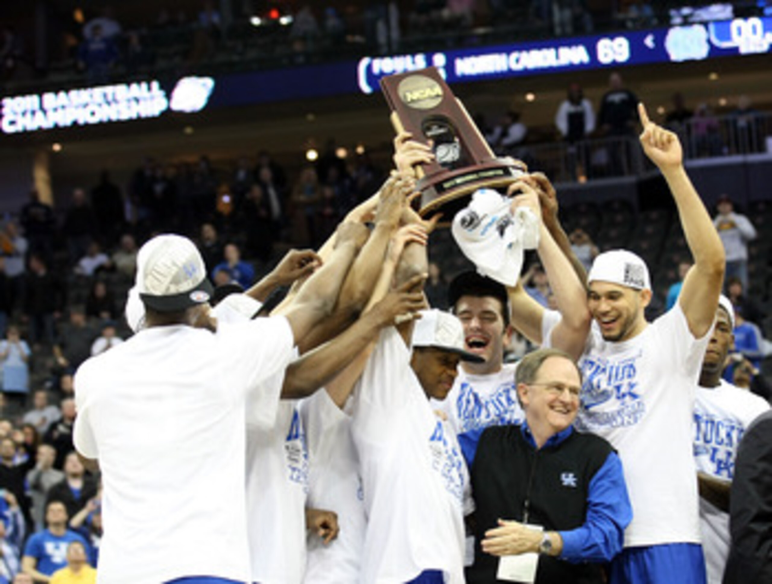 NEWARK, NJ - MARCH 27:  The Kentucky Wildcats pose with the trophy after defeating the North Carolina Tar Heels in the east regional final of the 2011 NCAA men's basketball tournament at Prudential Center on March 27, 2011 in Newark, New Jersey.  (Photo b