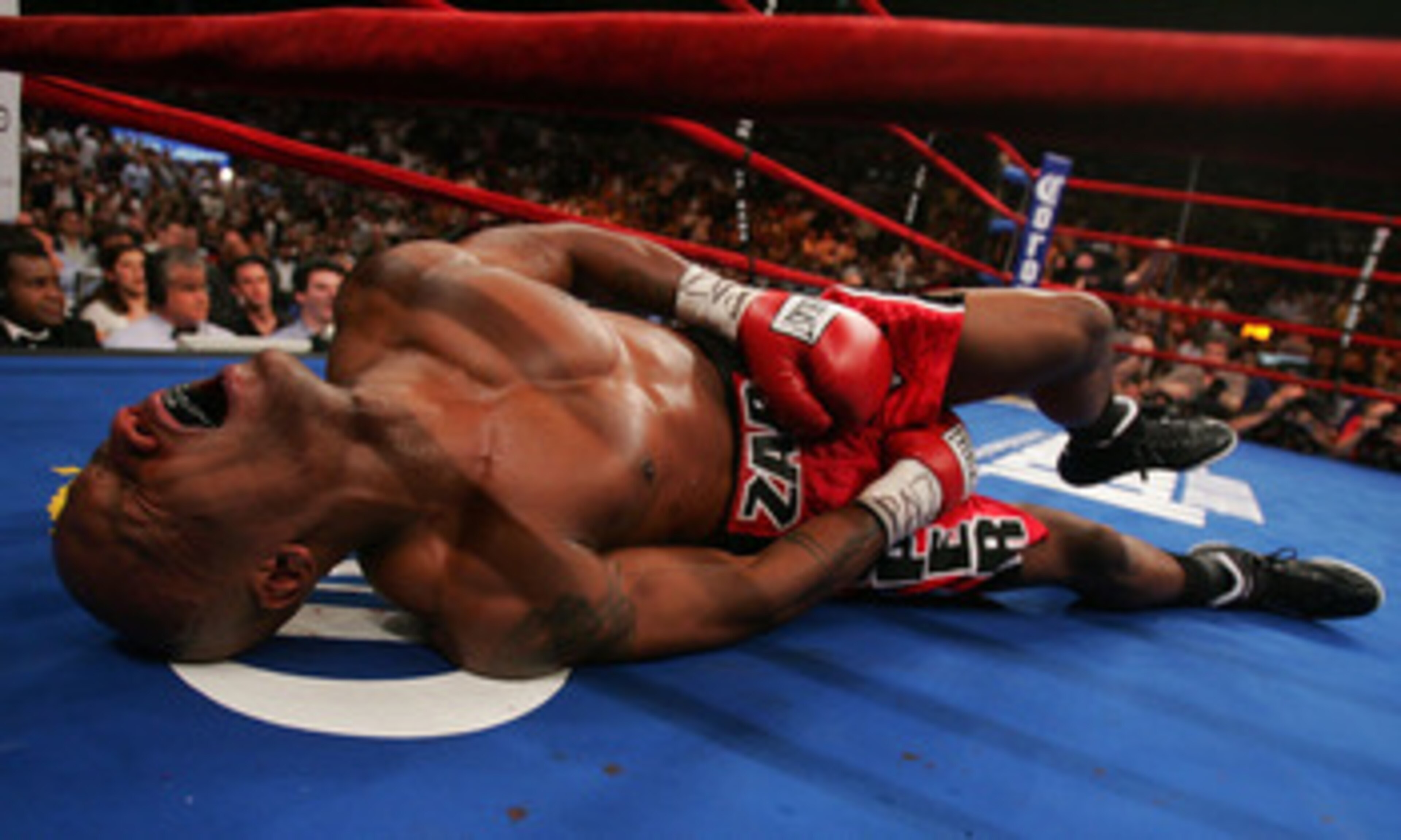 NEW YORK - JUNE 9: Zab Judah lays in agony on the canvas after being hit by a second low blow by Miguel Cotto of Puerto Rico during their WBA Welterweight Championship bout on June 9, 2007 at Madison Square Garden in New York City. (Photo by Nick Laham/Ge NEW YORK - JUNE 9: Zab Judah lays in agony on the canvas after being hit by a second low blow by Miguel Cotto of Puerto Rico during their WBA Welterweight Championship bout on June 9, 2007 at Madison Square Garden in New York City. (Photo by Nick Laham/Ge