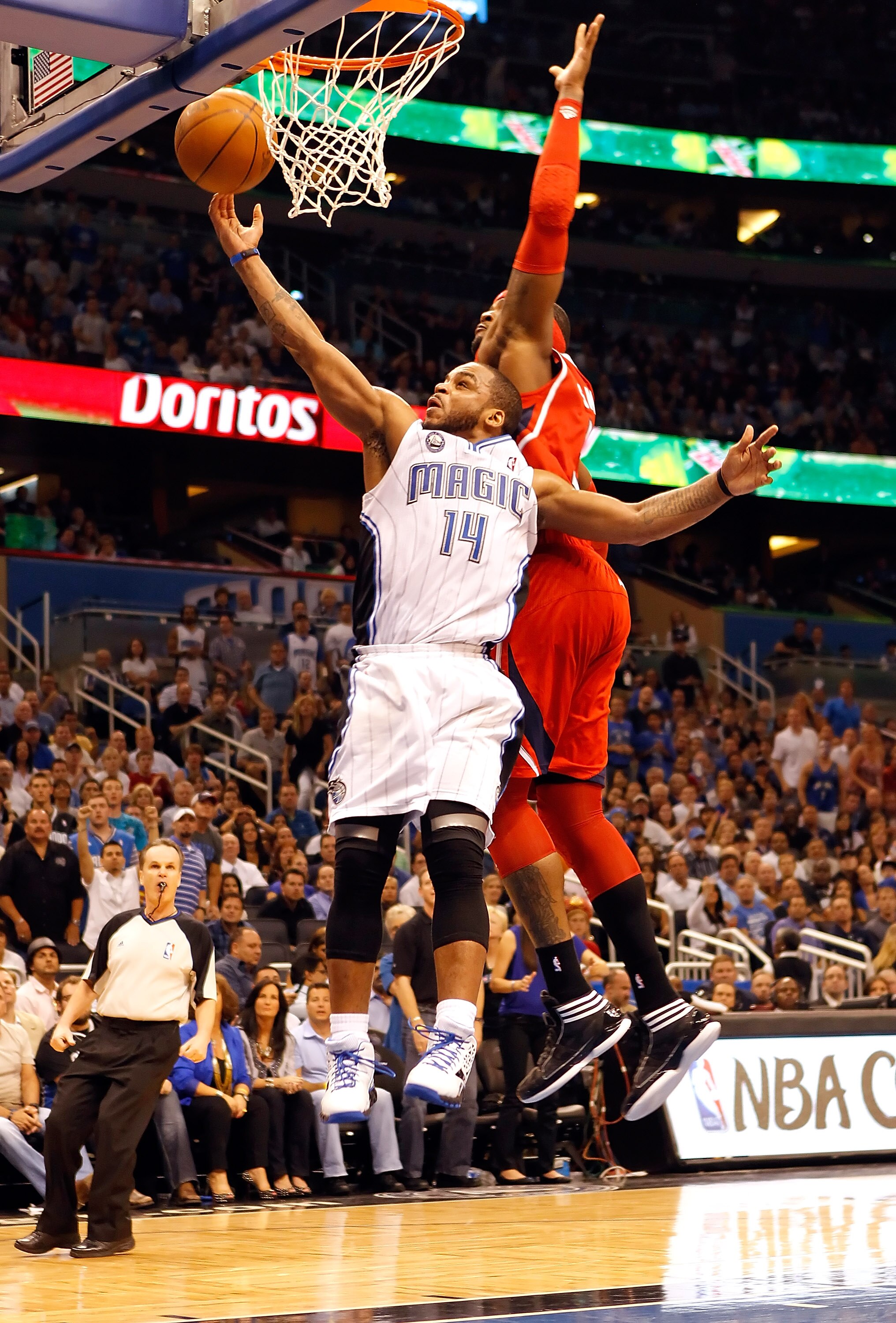 ORLANDO, FL - APRIL 19:  Jameer Nelson #14 of the Orlando Magic drives past Al Horford #15 of the Atlanta Hawks during Game Two of the Eastern Conference Quarterfinals of the 2011 NBA Playoffs on April 19, 2011 at the Amway Arena in Orlando, Florida.  NOT