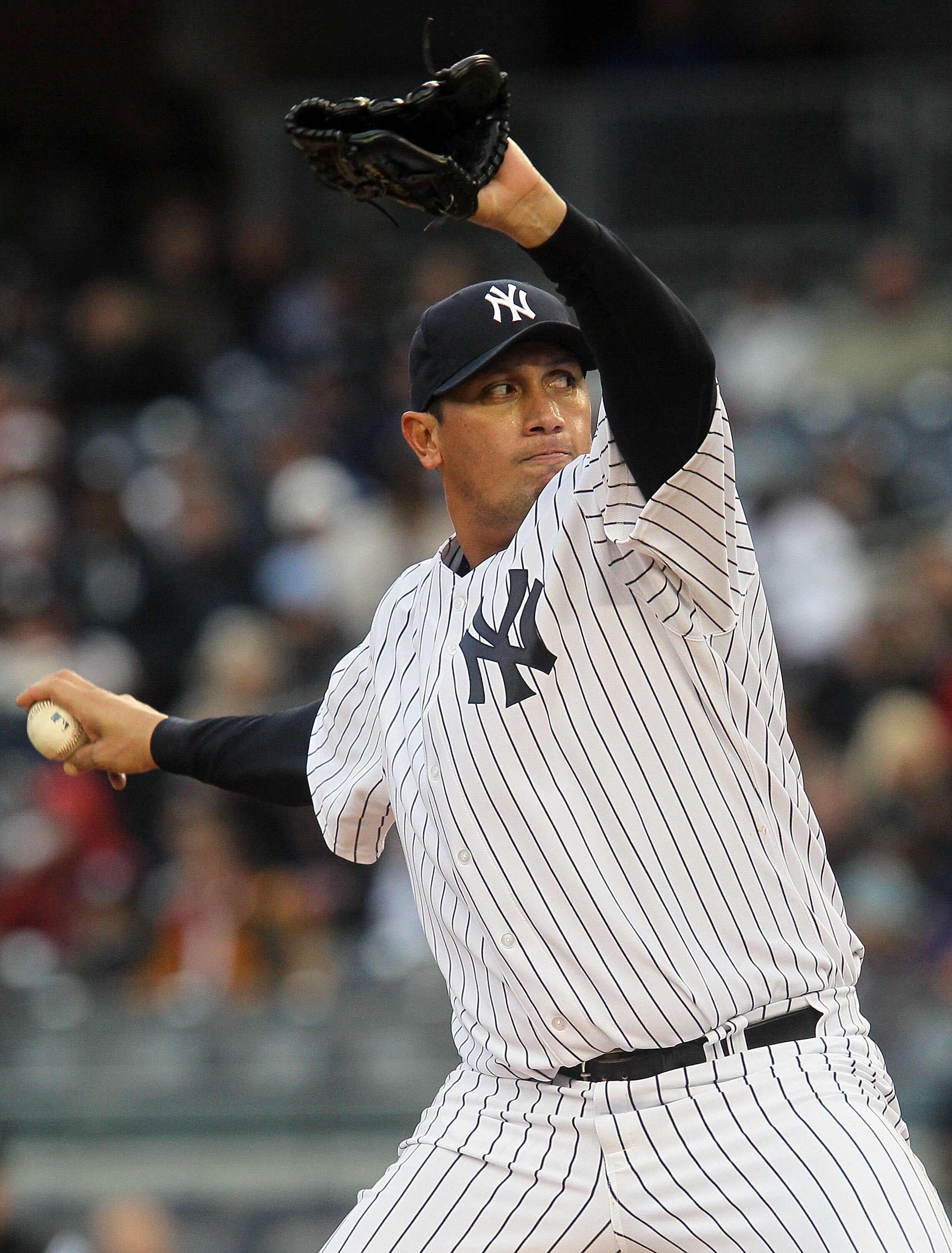 NEW YORK, NY - APRIL 16:  Freddy Garcia #36 of the New York Yankees delivers a pitch against the Texas Rangers on April 16, 2011 at Yankee Stadium in the Bronx borough of New York City.  (Photo by Jim McIsaac/Getty Images)