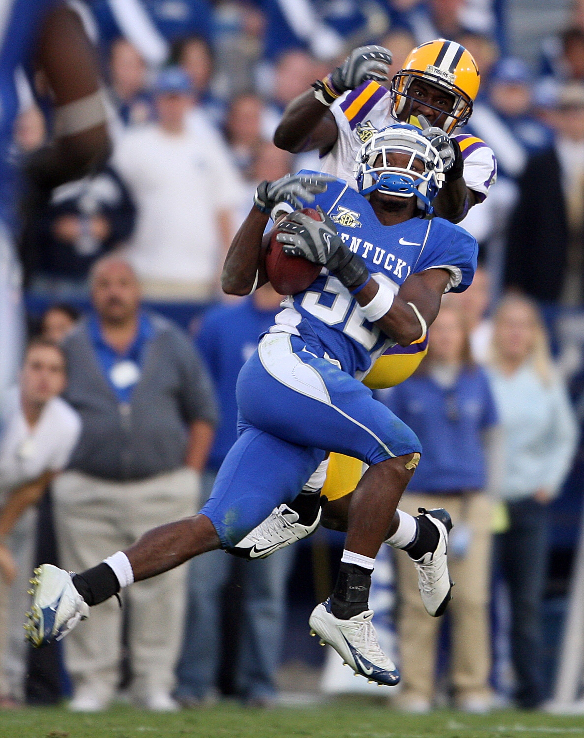 LEXINGTON, KY - OCTOBER 13:  Trevard Lindley #32 of the Kentucky Wildcats intercepts a pass intended for Brandon LaFell #1 of the LSU Tigers during the SEC game at Commonwealth Stadium October 13, 2007 in Lexington, Kentucky. Kentucky won 43-37.  (Photo b