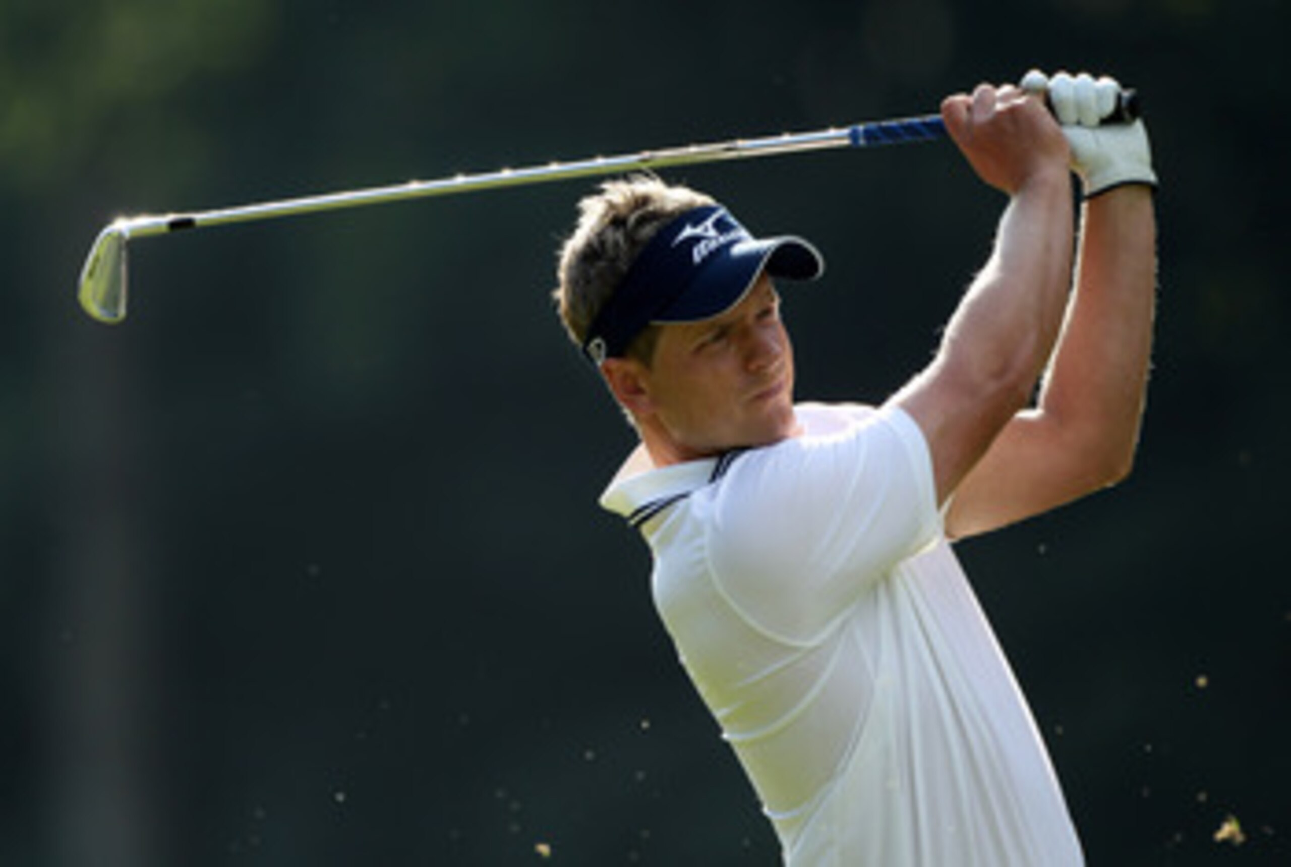 VIRGINIA WATER, ENGLAND - MAY 29:  Luke Donald of England plays his second shot into the 17th green during the final round of the BMW PGA Championship  at the Wentworth Club on May 29, 2011 in Virginia Water, England.  (Photo by Warren Little/Getty Images