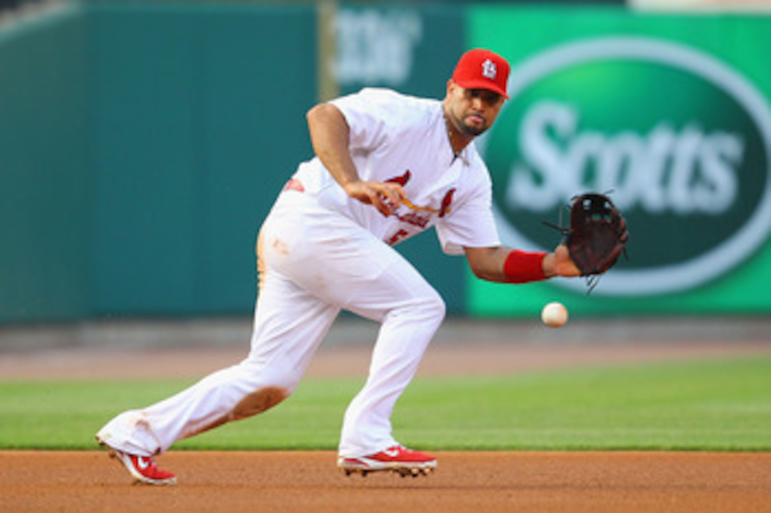 ST. LOUIS, MO - MAY 31: Albert Pujols #5 of the St. Louis Cardinals fields a one hopper at third base against the San Francisco Giants at Busch Stadium on May 31, 2011 in St. Louis, Missouri.  (Photo by Dilip Vishwanat/Getty Images)