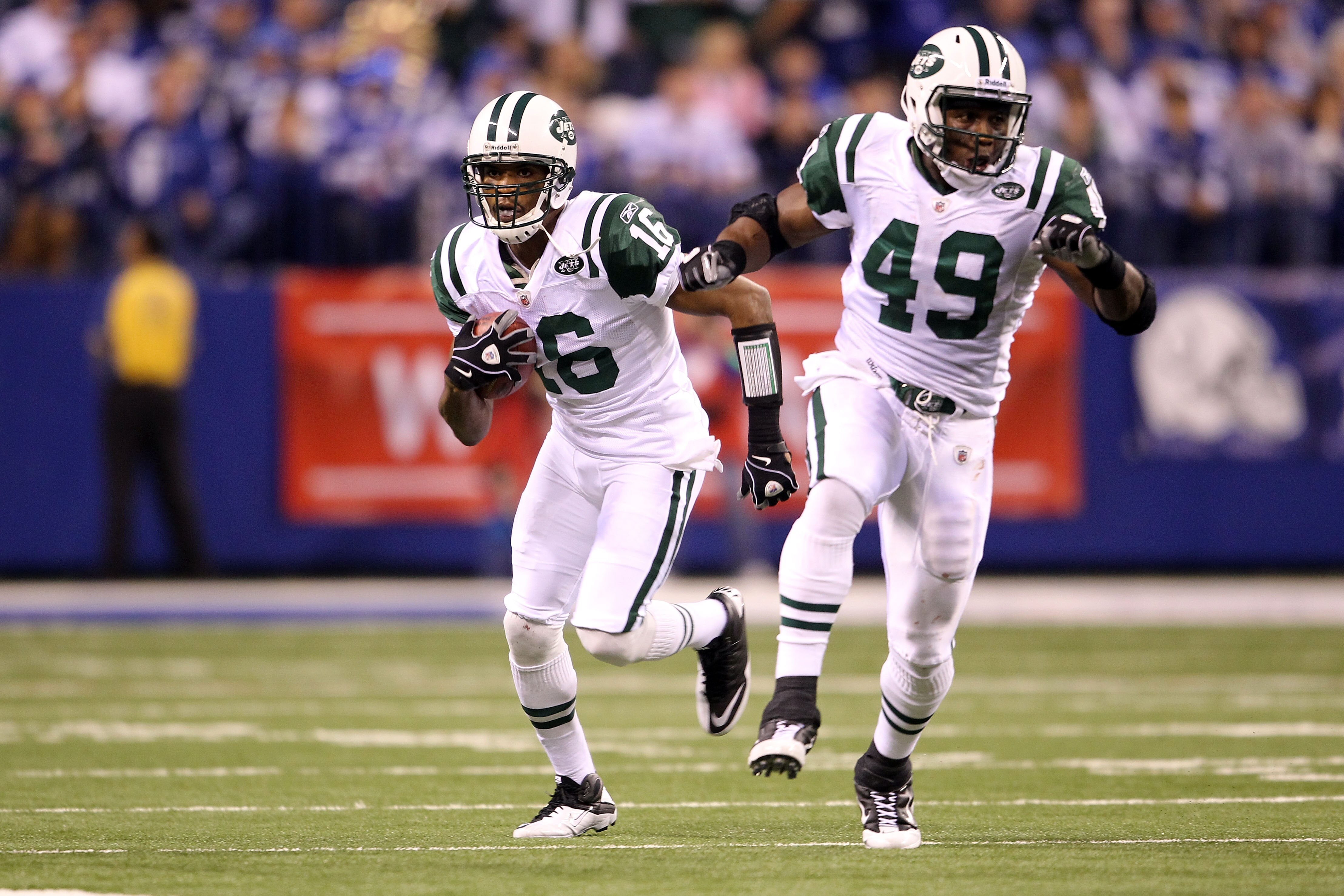 INDIANAPOLIS, IN - JANUARY 08:  Brad Smith #16 of the New York Jets runs with the ball behind the blocking of Tony RIchardson #49 against the Indianapolis Colts during their 2011 AFC wild card playoff game at Lucas Oil Stadium on January 8, 2011 in Indian