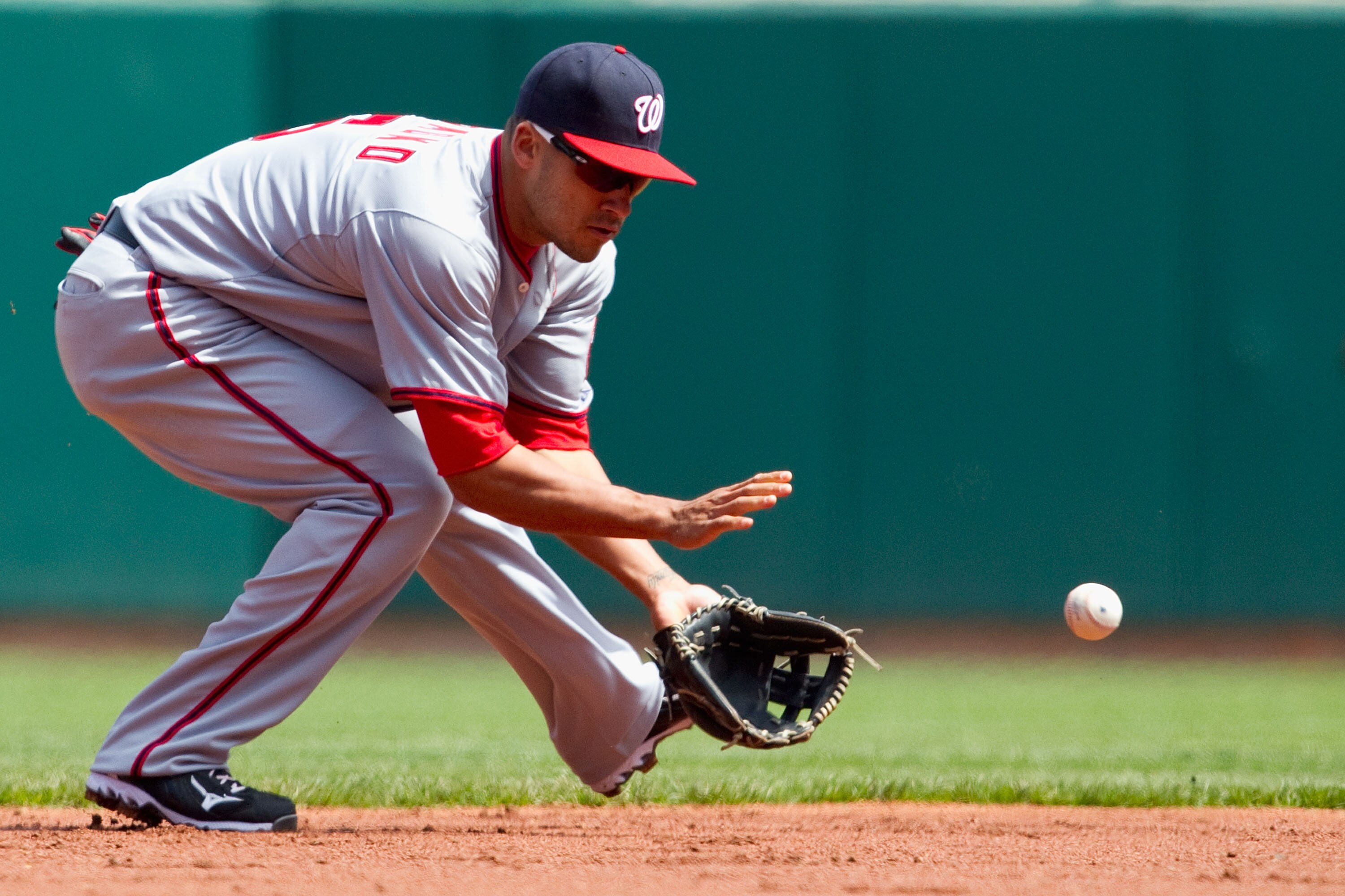 ST. LOUIS, MO - APRIL 21: Ian Desmond #6 of the Washington Nationals fields a ground ball against the St. Louis Cardinals at Busch Stadium on April 21, 2011 in St. Louis, Missouri.  (Photo by Dilip Vishwanat/Getty Images)