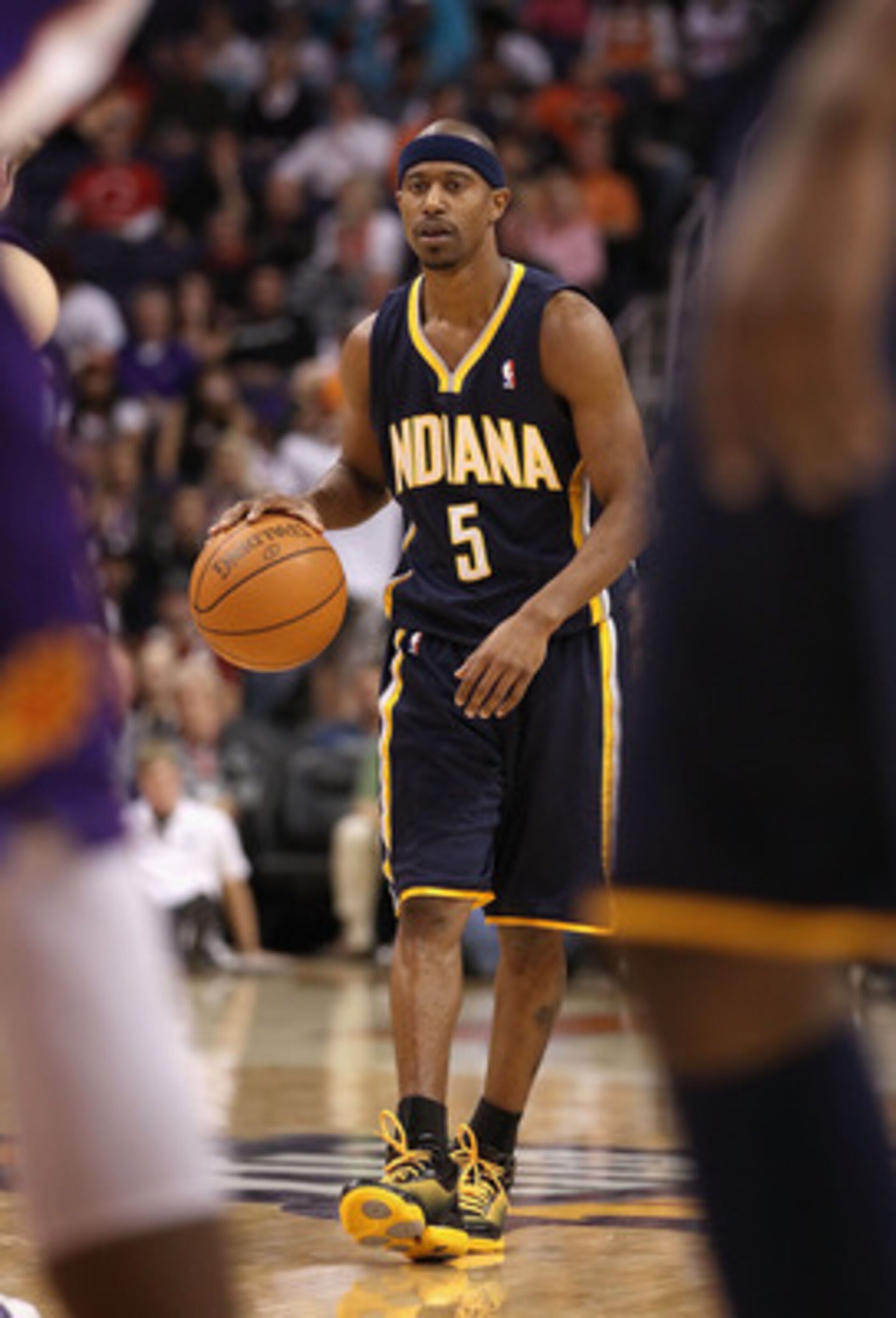 PHOENIX - DECEMBER 03:  T.J. Ford #5 of the Indiana Pacers handles the ball during the NBA game against the Phoenix Suns at US Airways Center on December 3, 2010 in Phoenix, Arizona.  The Suns defeated the Pacers 105-97.  NOTE TO USER: User expressly ackn