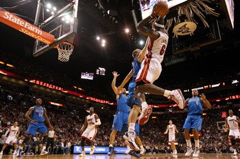 MIAMI, FL - DECEMBER 20:  LeBron James #6 of the Miami Heat passes over Dirk Nowitzki #41 of the Dallas Mavericks  during a game at American Airlines Arena on December 20, 2010 in Miami, Florida. NOTE TO USER: User expressly acknowledges and agrees that,