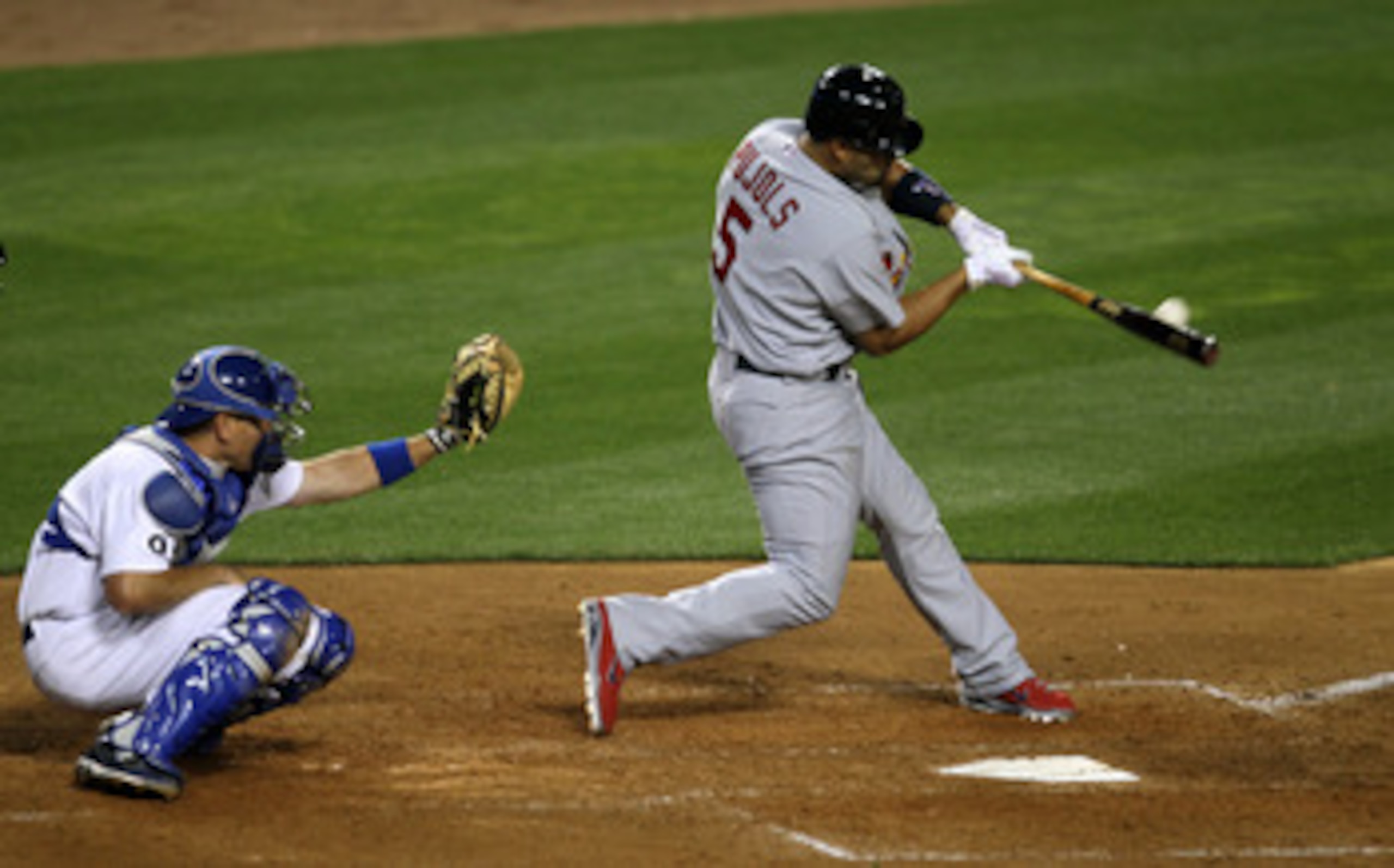LOS ANGELES - APRIL 14:  Albert Pujols #5 of the St Louis Cardinals hits a home run in the fifth inning against the Los Angeles Dodgers on April 14, 2011 at Dodger Stadium in Los Angeles, California.  (Photo by Stephen Dunn/Getty Images)