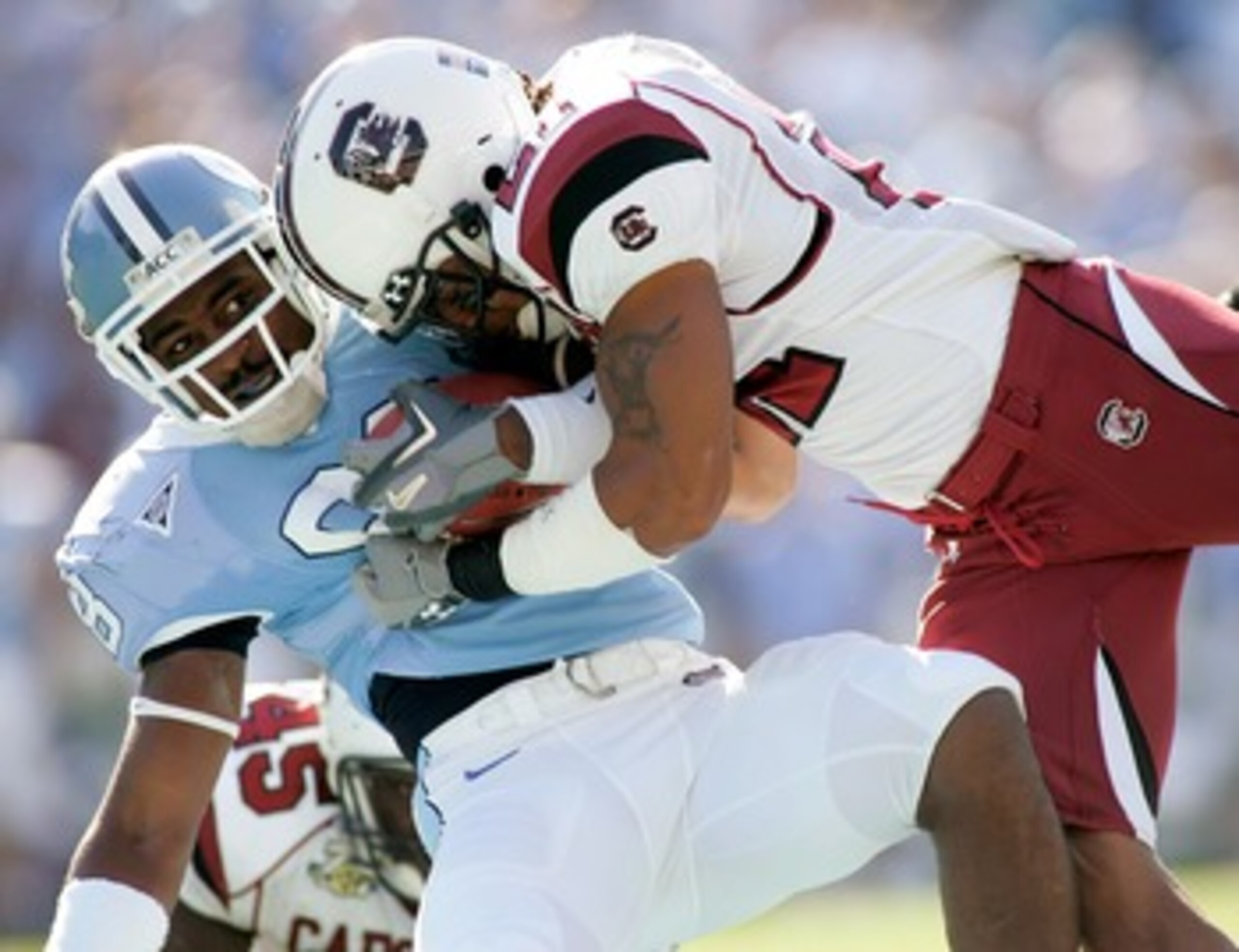CHAPEL HILL, NC - OCTOBER 13:  Emanuel Cook #21 of the South Carolina Gamecocks tackles Hakeem Nicks #88 of the North Carolina Tar Heels in the first quarter at Kenan Stadium October 13, 2007 in Chapel Hill, North Carolina.  (Photo by Grant Halverson/Gett