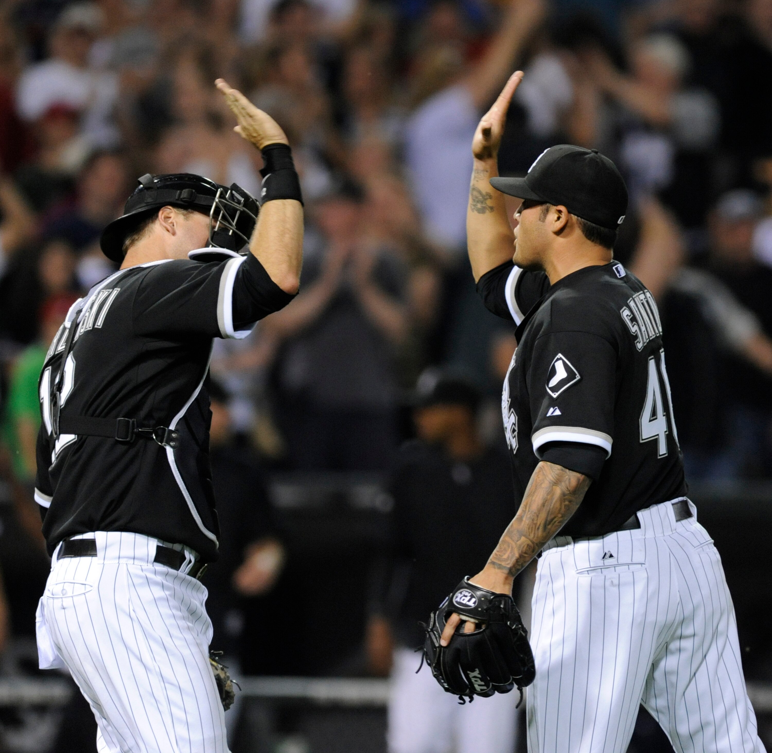CHICAGO, IL - JUNE 03: A.J. Pierzynski # 12 of the Chicago White Sox and Sergio Santos celebrate their victory against the Detroit Tigers on June 3, 2011 at U.S. Cellular Field in Chicago, Illinois. The White Sox defeated the Tigers 6-4. (Photo by David B