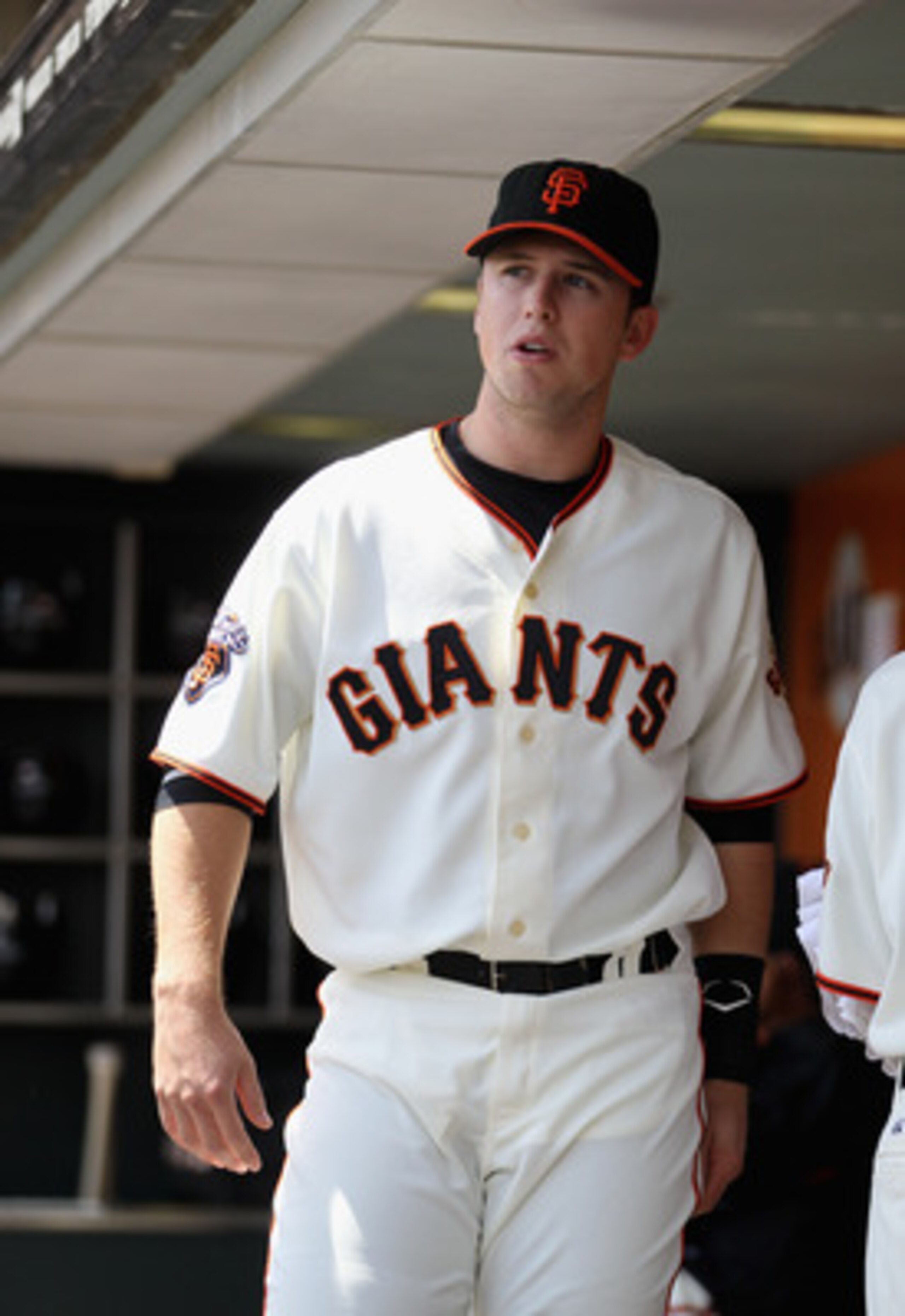 SAN FRANCISCO, CA - APRIL 24:  Buster Posey #28 of the San Francisco Giants stands in the dugout before their game against the Atlanta Braves at AT&T Park on April 24, 2011 in San Francisco, California.  (Photo by Ezra Shaw/Getty Images)