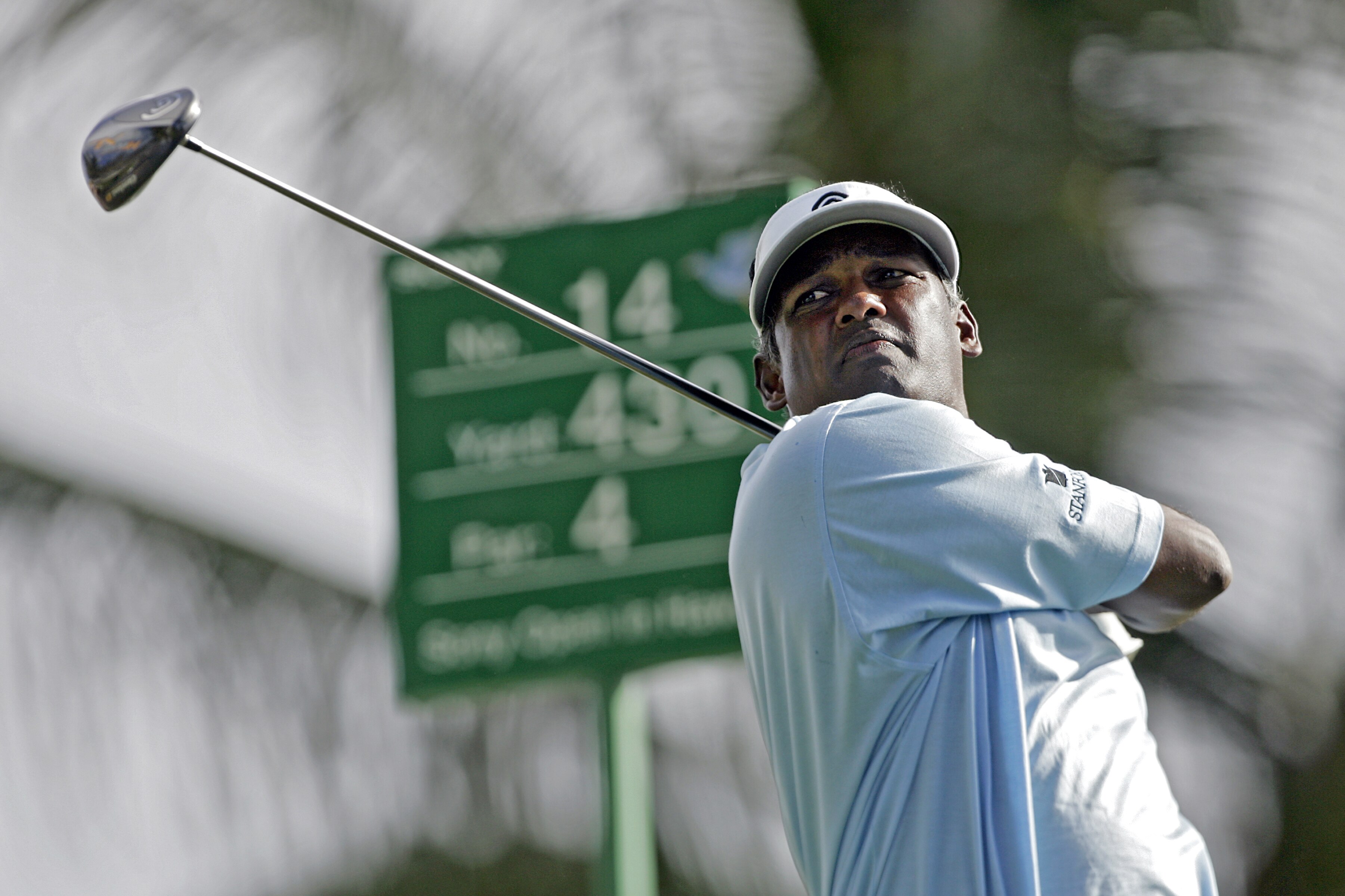 UNITED STATES - JANUARY 11:  Vijay Signh follows his shot off the 14th tee during the first round of the Sony Open held at the Waialae Country Club in Honolulu, Hawaii on January 11, 2007.  (Photo by Marco Garcia/Getty Images)