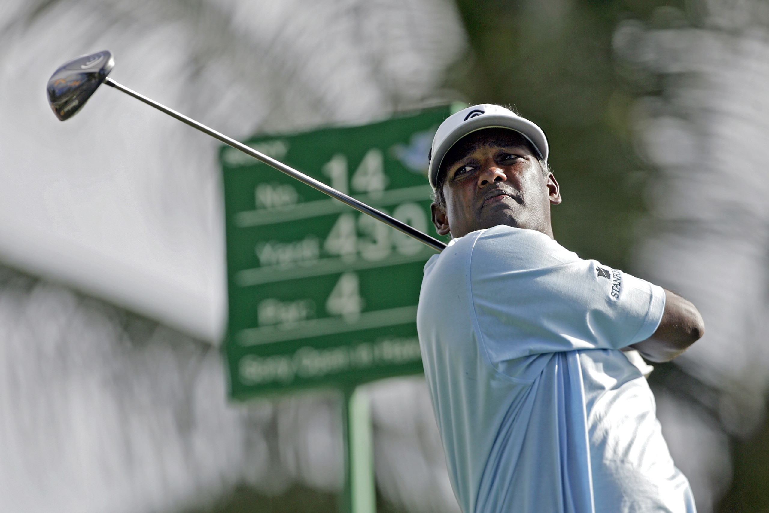 UNITED STATES - JANUARY 11:  Vijay Signh follows his shot off the 14th tee during the first round of the Sony Open held at the Waialae Country Club in Honolulu, Hawaii on January 11, 2007.  (Photo by Marco Garcia/Getty Images)