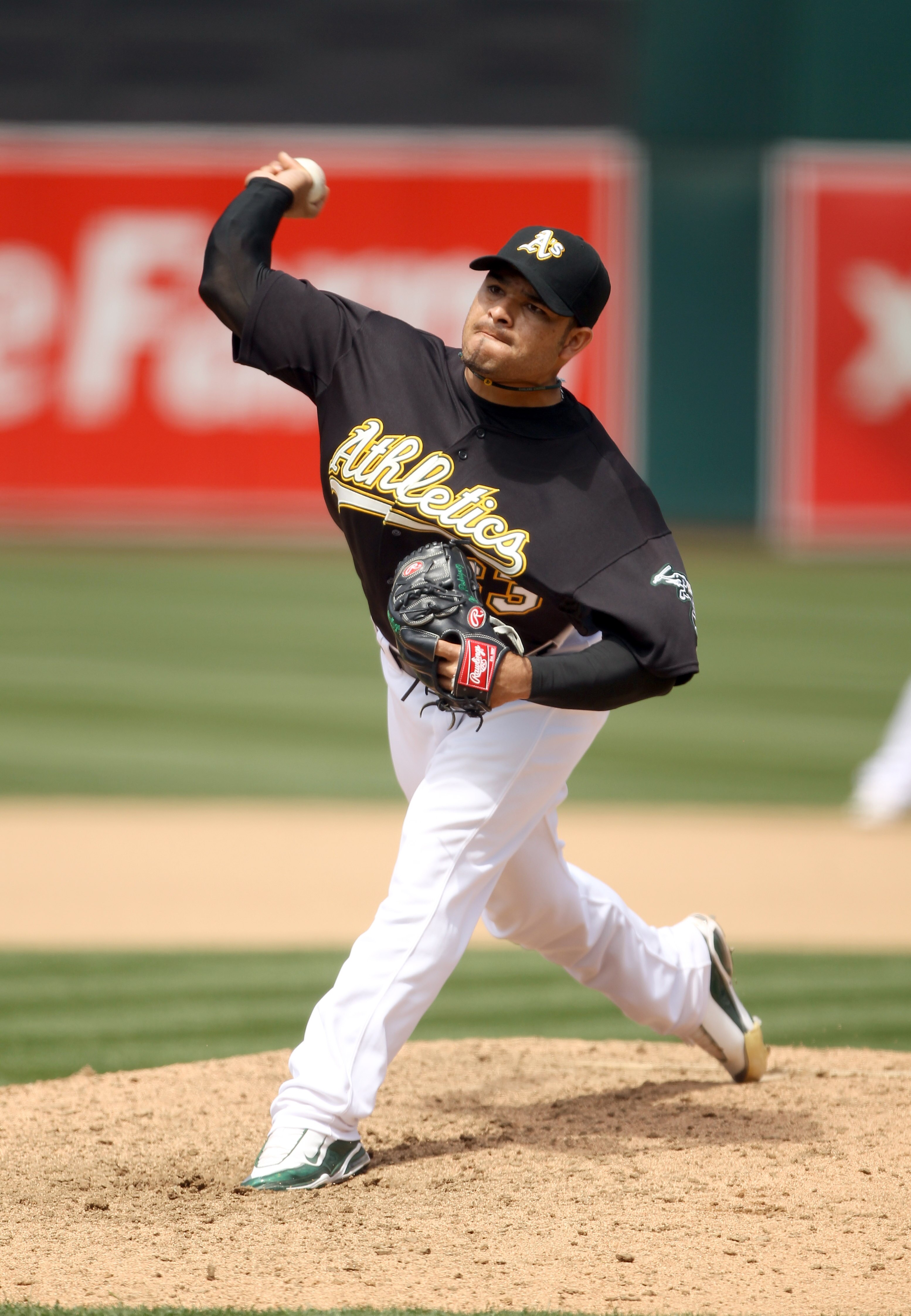 OAKLAND, CA - JULY 21:  Henry Rodriguez #63 of the Oakland Athletics pitches against the Boston Red Sox at the Oakland-Alameda County Coliseum on July 21, 2010 in Oakland, California.  (Photo by Ezra Shaw/Getty Images)