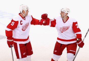 GLENDALE, AZ - APRIL 14:  Nicklas Lidstrom #5 and Brian Rafalski #28 of the Detroit Red Wings celebrate after Nicklas Lidstrom scored a first period power play goal against the Phoenix Coyotes in Game One of the Western Conference Quarterfinals during the