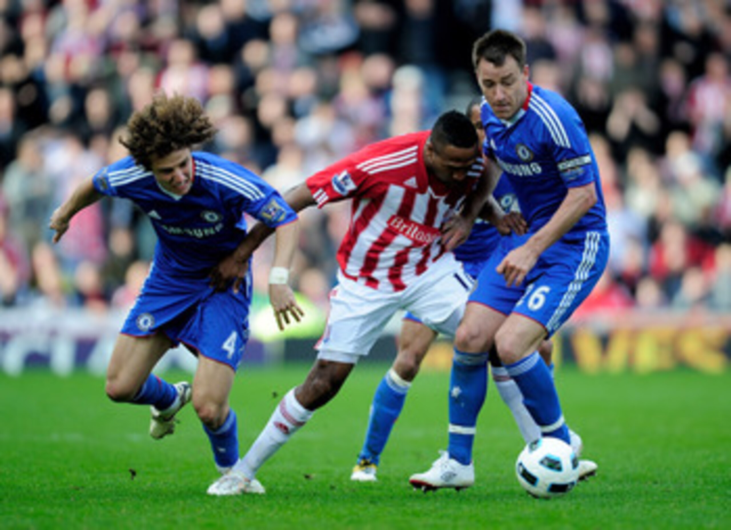 STOKE ON TRENT, ENGLAND - APRIL 02: Ricardo Fuller of Stoke City battles for the ball with David Luiz (L) and John Terry of Chelsea during the Barclays Premier League match between Stoke City and Chelsea at the Britannia Stadium on April 2, 2011 in Stoke STOKE ON TRENT, ENGLAND - APRIL 02: Ricardo Fuller of Stoke City battles for the ball with David Luiz (L) and John Terry of Chelsea during the Barclays Premier League match between Stoke City and Chelsea at the Britannia Stadium on April 2, 2011 in Stoke